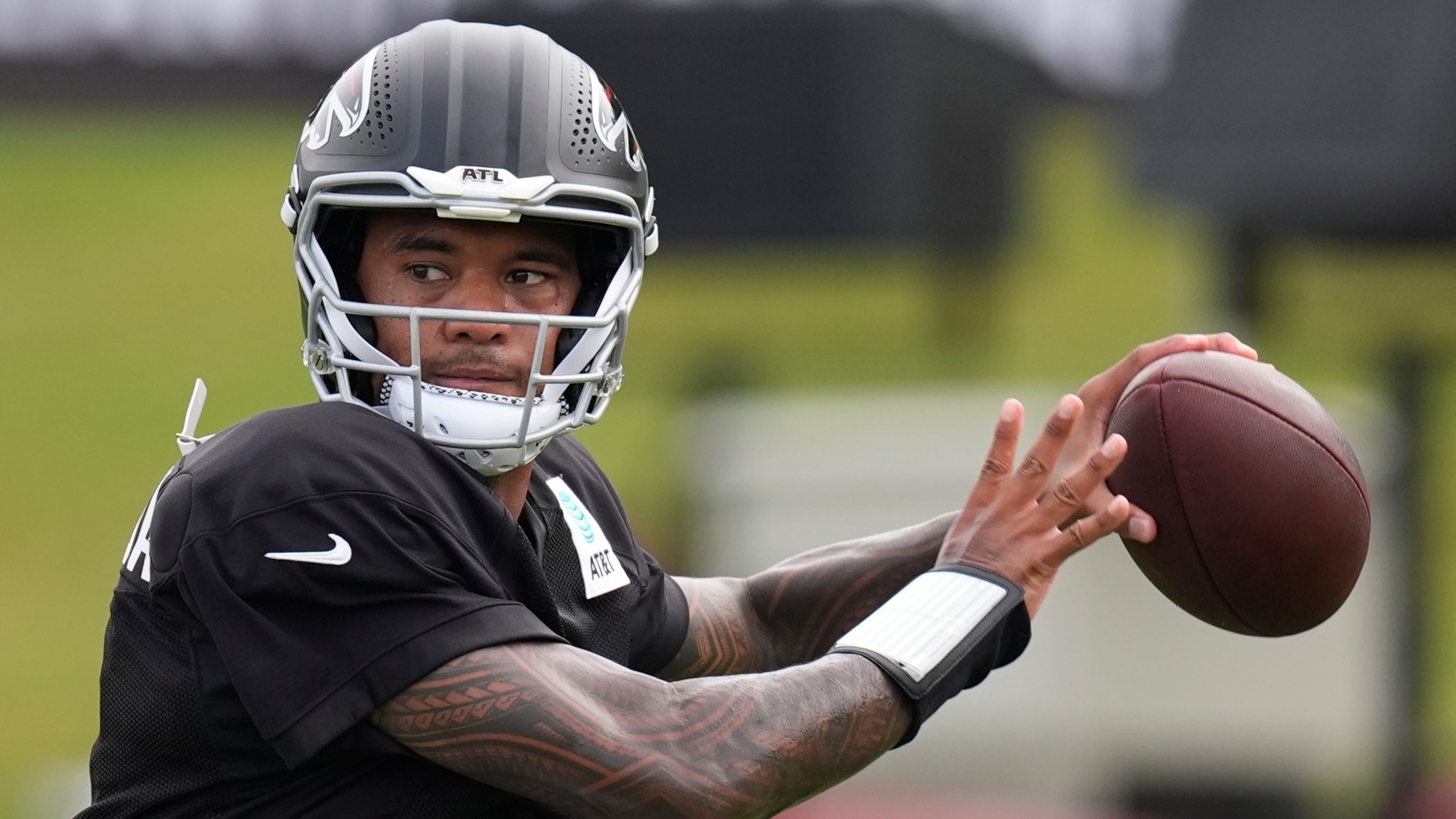 Atlanta Falcons quarterback Tua Tagovailoa (1) works out during an NFL training camp, Friday, Aug. 7, 2026, in Flowery Branch, Ga. (AP Photo/Mike Stewart)