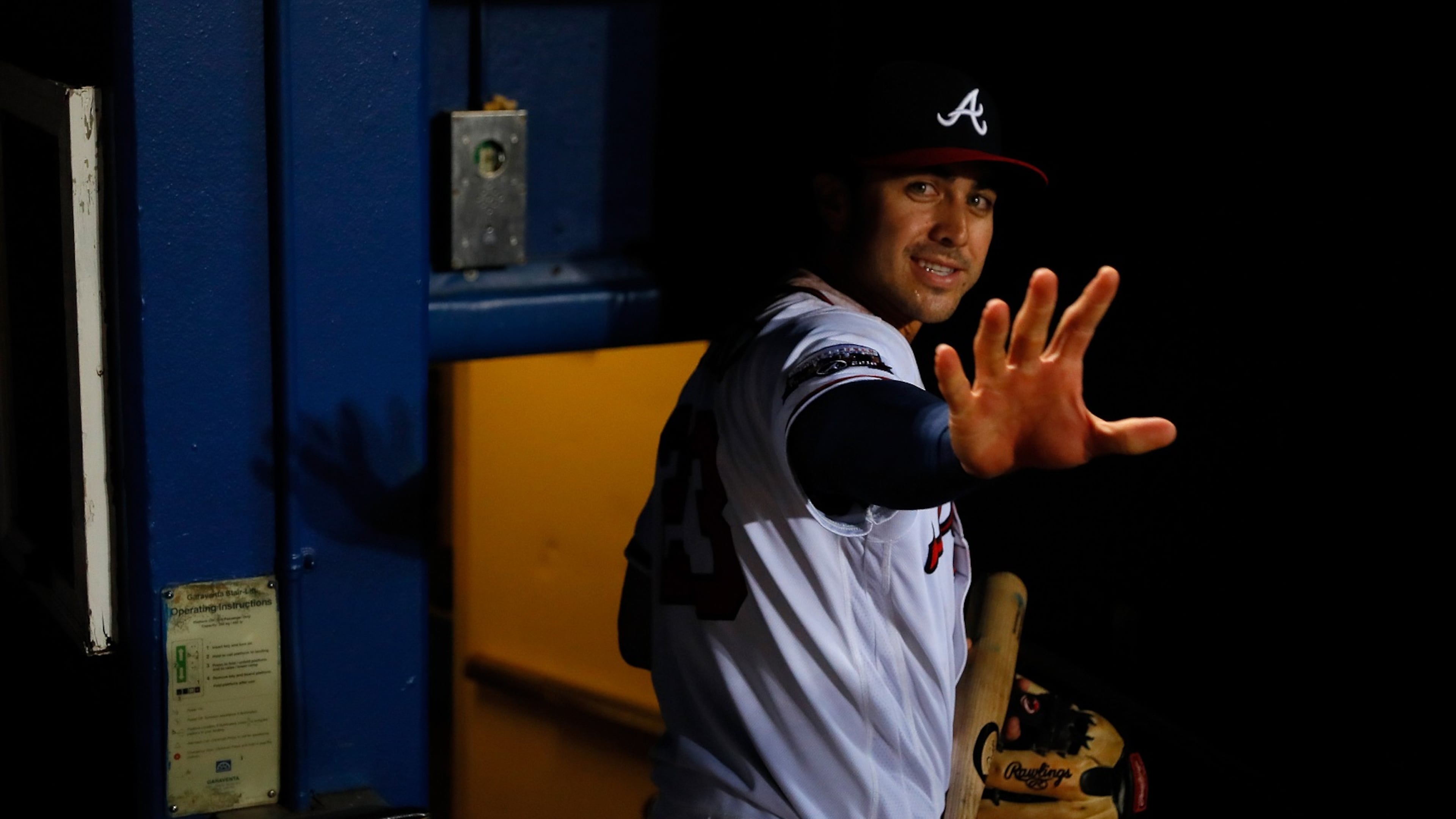 Chase d’Arnaud waves as he leaves the dugout after giving the Braves a 13-inning win over the Reds. (Photo by Kevin C. Cox/Getty Images)