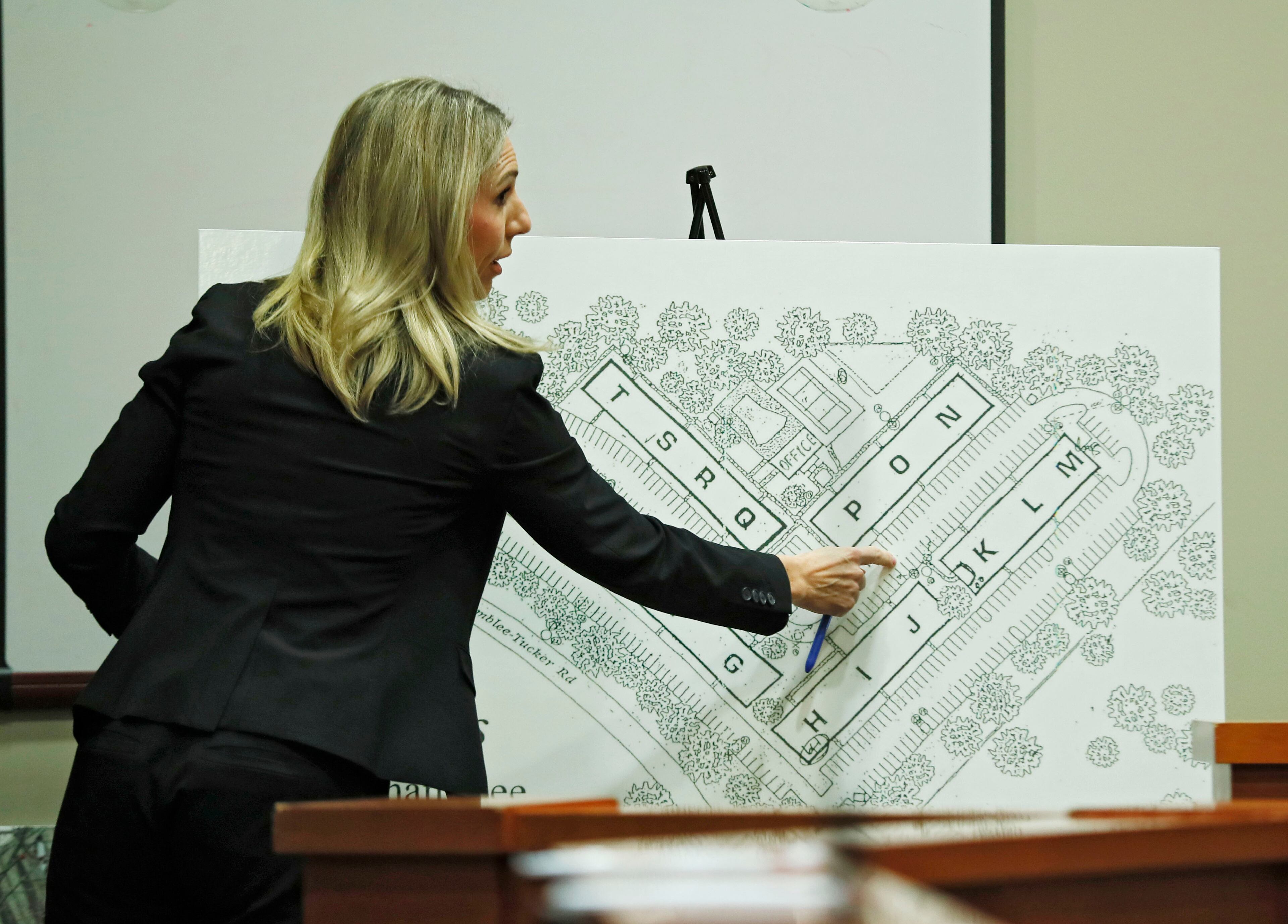 September 27, 2019 - Decatur - Defense attorney Amanda Clark Palmer uses a map of the apartment complex during cross examination of Pedro Castillo Flores to show where he was during the shooting. The murder trial of former DeKalb County Police Officer Robert "Chip" Olsen continued with testimony from prosecution witnesses this morning. Olsen is charged with murdering war veteran Anthony Hill. Bob Andres / robert.andres@ajc.com
