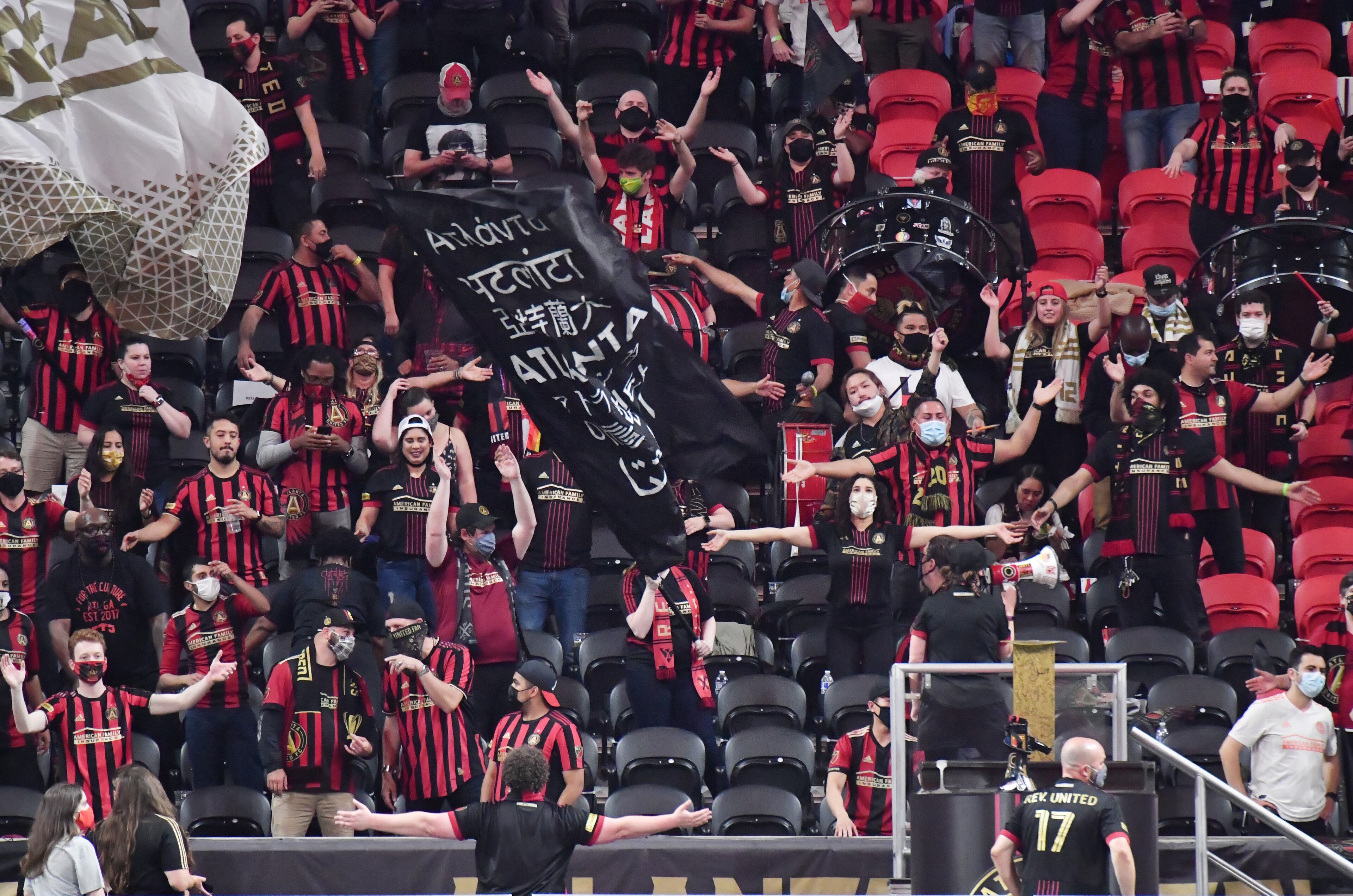 Atlanta United fans cheer during the first half in an MLS soccer match at Mercedes-Benz Stadium in Atlanta on Saturday, April 24, 2021. (Hyosub Shin / Hyosub.Shin@ajc.com)