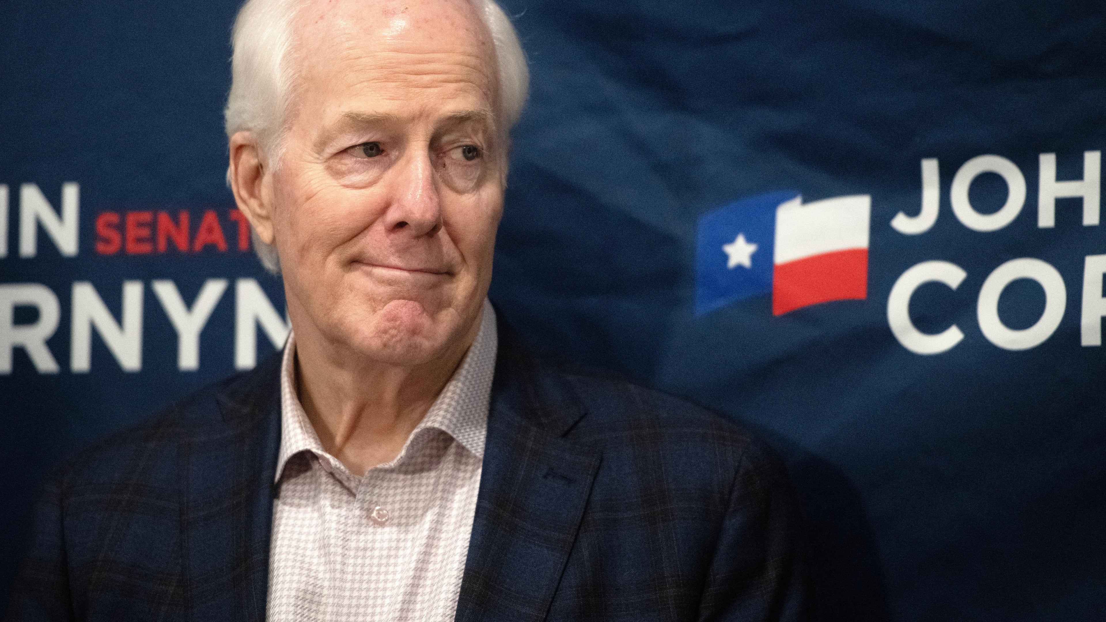 Sen. John Cornyn, R-Texas, listens to State Sen. Charles Perry, R-Lubbock, during a campaign event in Lubbock, Texas, Tuesday, May 19, 2026. (AP Photo/Annie Rice)