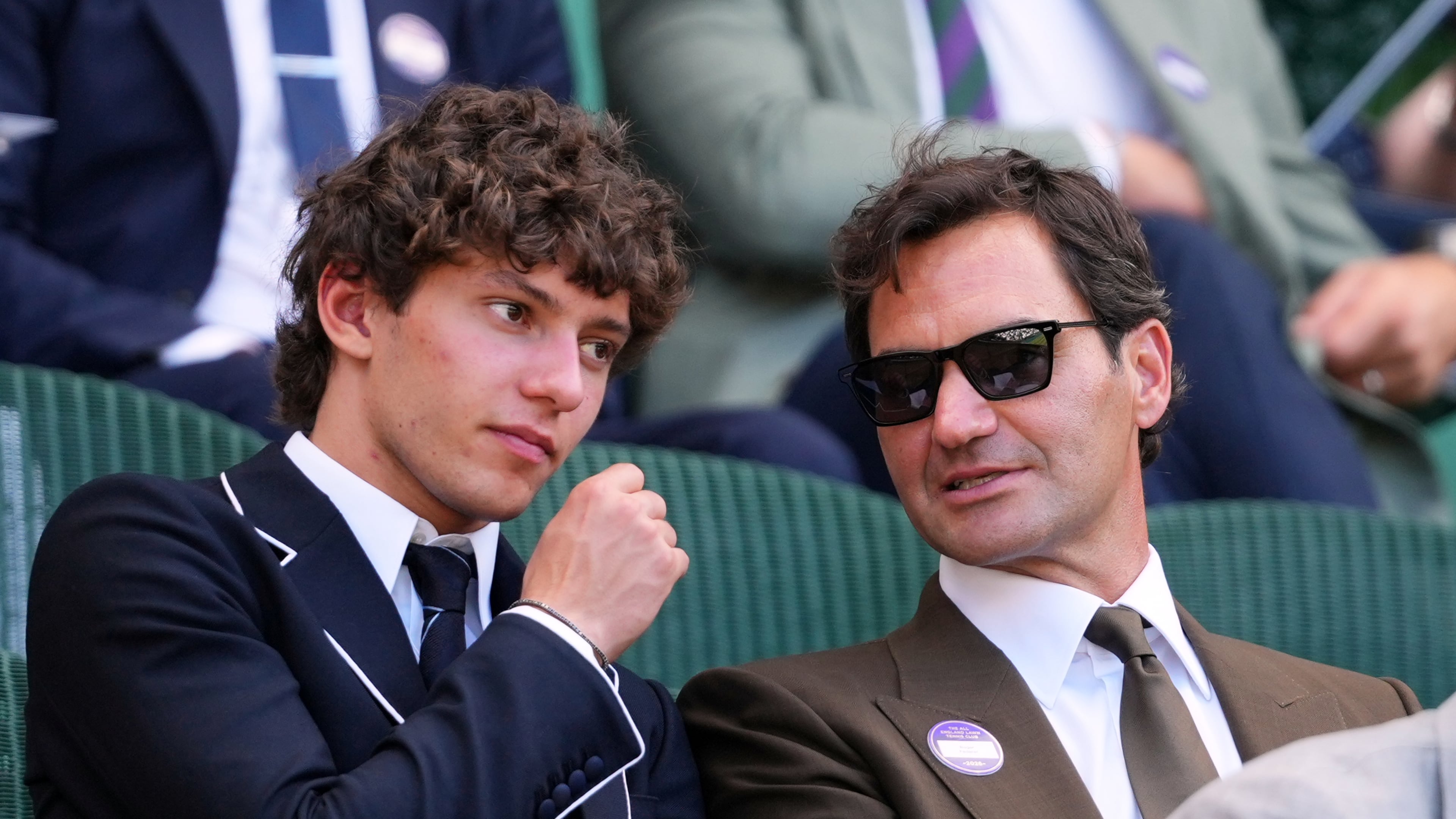 F1 Mercedes driver Andrea Kimi Antonelli of Italy sits beside former tennis player Roger Federer of Switzerland in the Royal Box on day eight at the Wimbledon Tennis Championships in London, Monday, July 6, 2026.(AP Photo/Kirsty Wigglesworth)