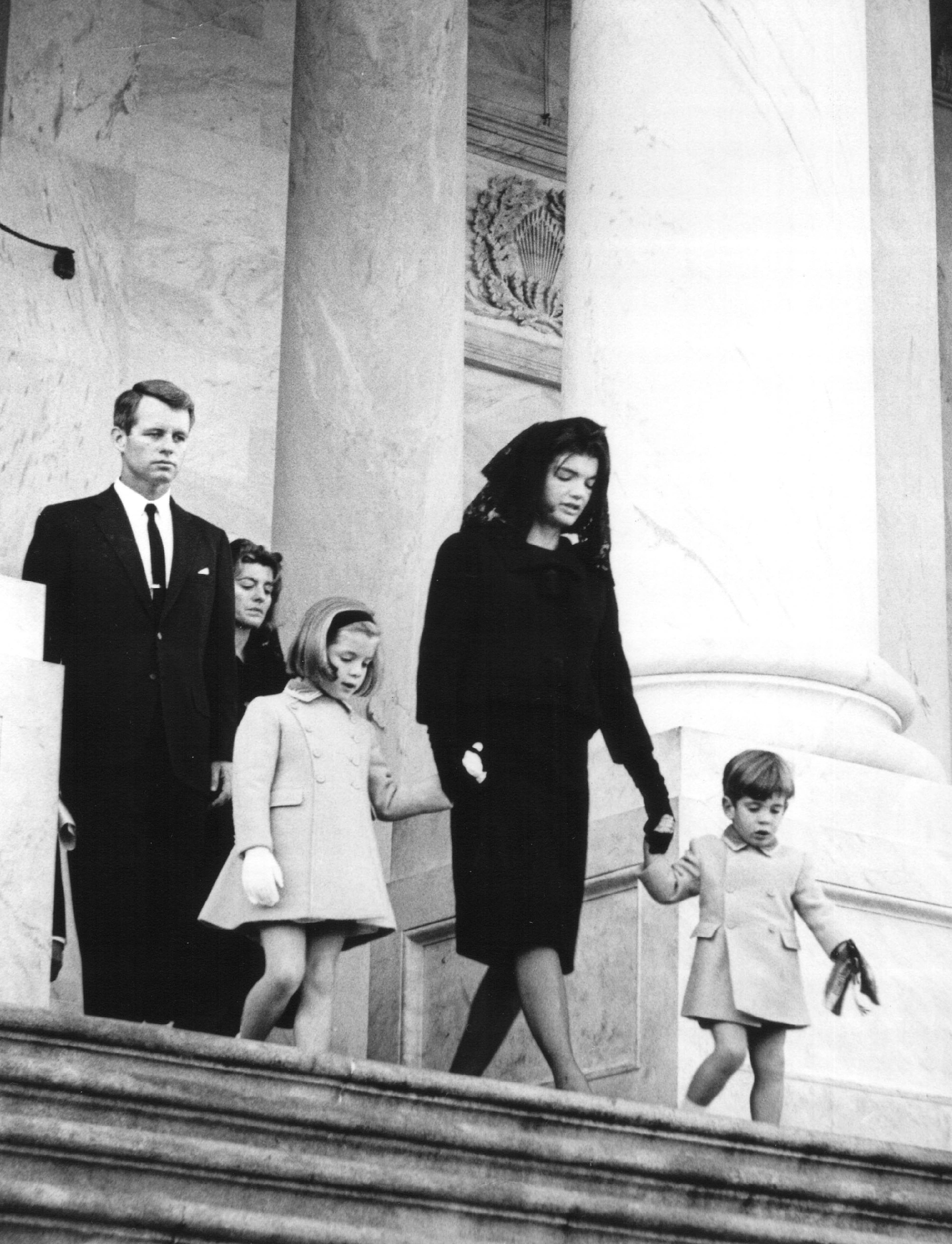 Jacqueline Kennedy leaves the U.S. Capitol Building with her children John and Caroline after attending a ceremony for her late husband John F. Kennedy. (National Archive/Newsmakers)