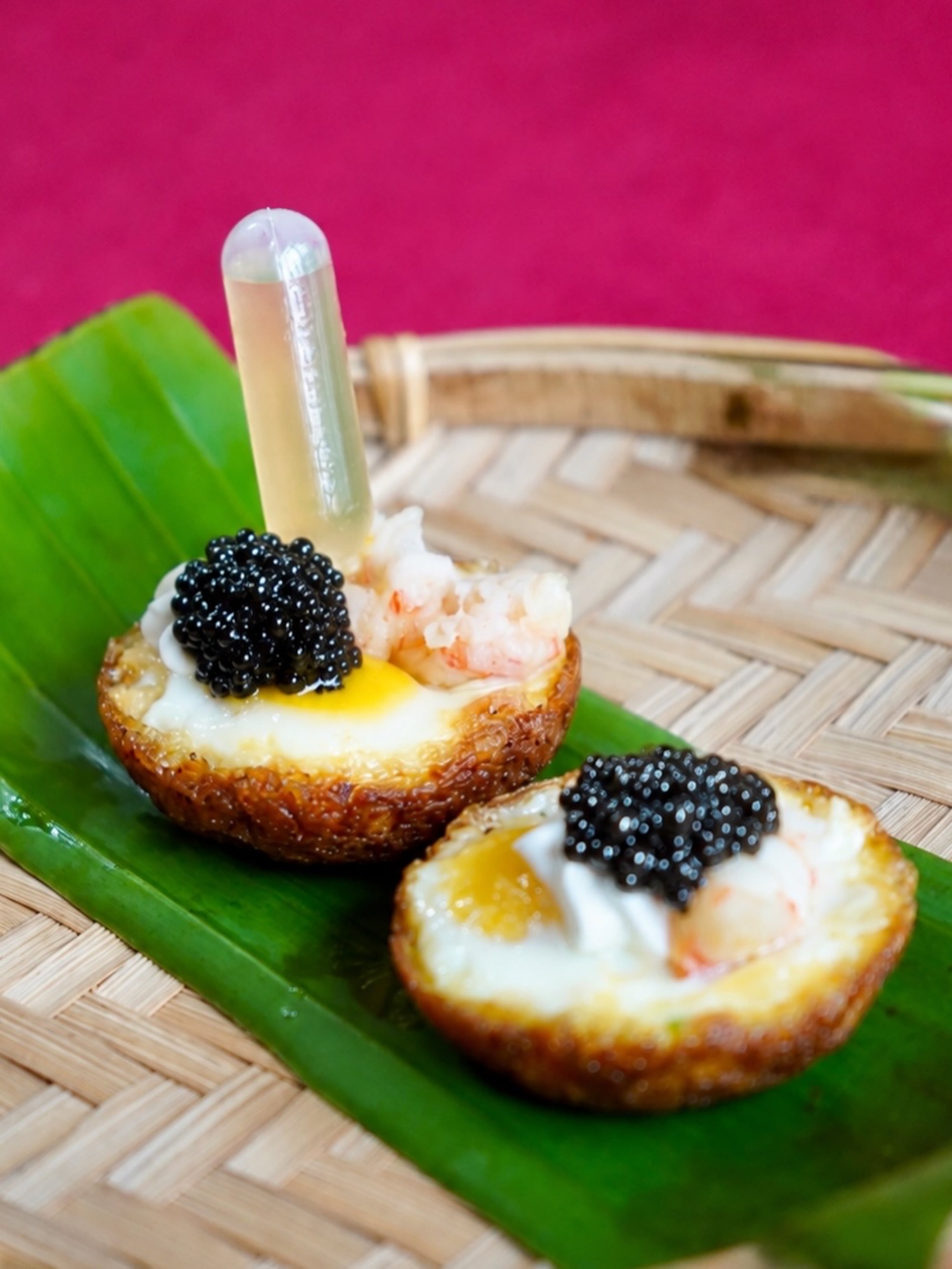 Karly's Kitchen’s langostino and quail egg banh khot, shown here with a vial of fish sauce. (Courtesy of Atlanta Cravings)