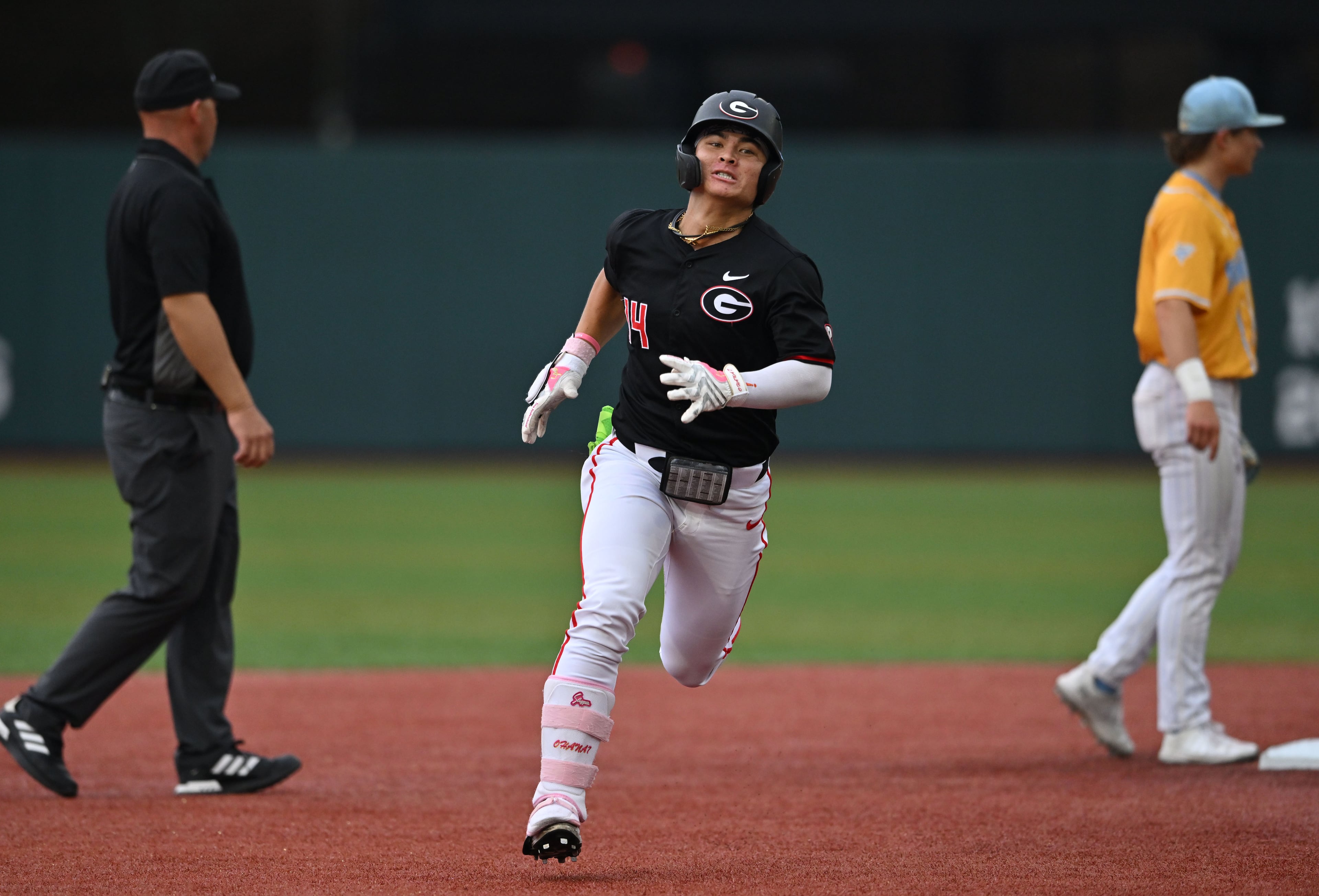 Georgia Kenny Ishikawa (14) hits a single, but advances to third base on a throwing error during the third inning of their NCAA Regional game at Foley Field, Friday, May 29, 2026, in Athens. (Hyosub Shin/AJC)