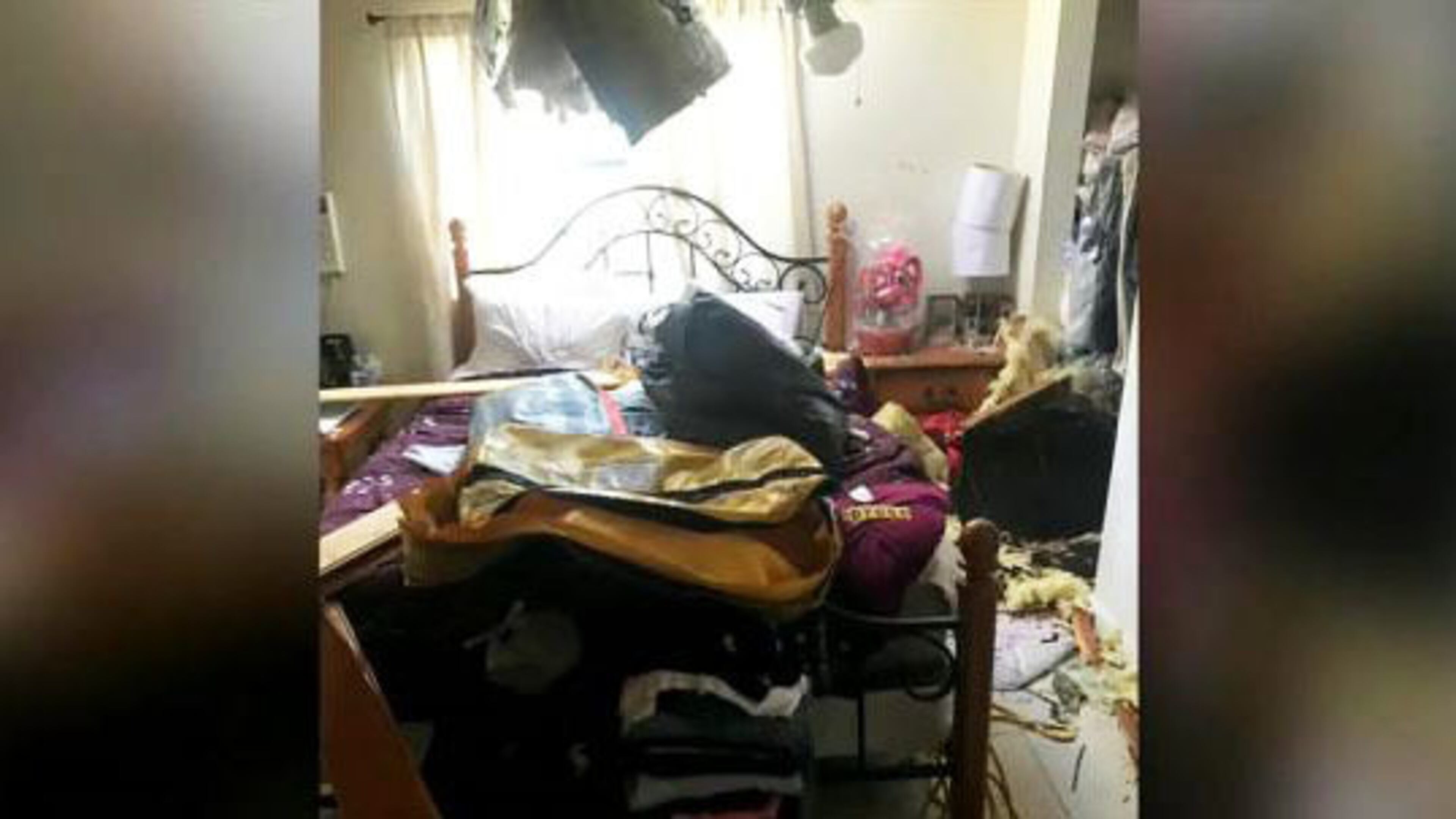 An 80-pound inflatable raft crashed into a Miami home Wednesday after falling off a Royal Canadian Air Force search-and-rescue helicopter, authorities said. (Photo: WFTV.com)