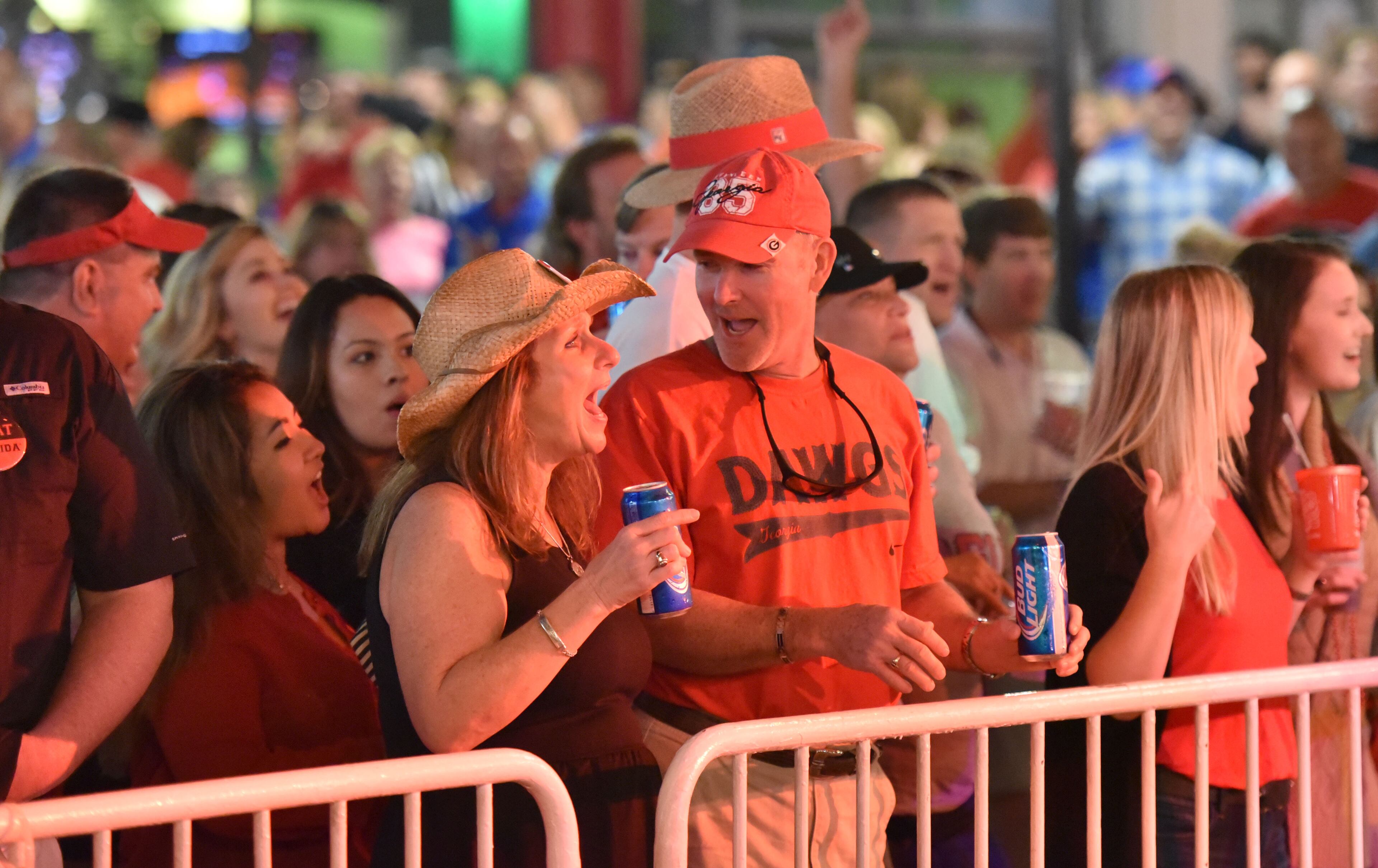 October 30, 2015 Jacksonville, Florida - Georgia and Florida fans gather to celebrate during an annual party at the Jacksonville Landing on the eve of the Georgia - Florida game on Friday, October 30, 2015. HYOSUB SHIN / HSHIN@AJC.COM