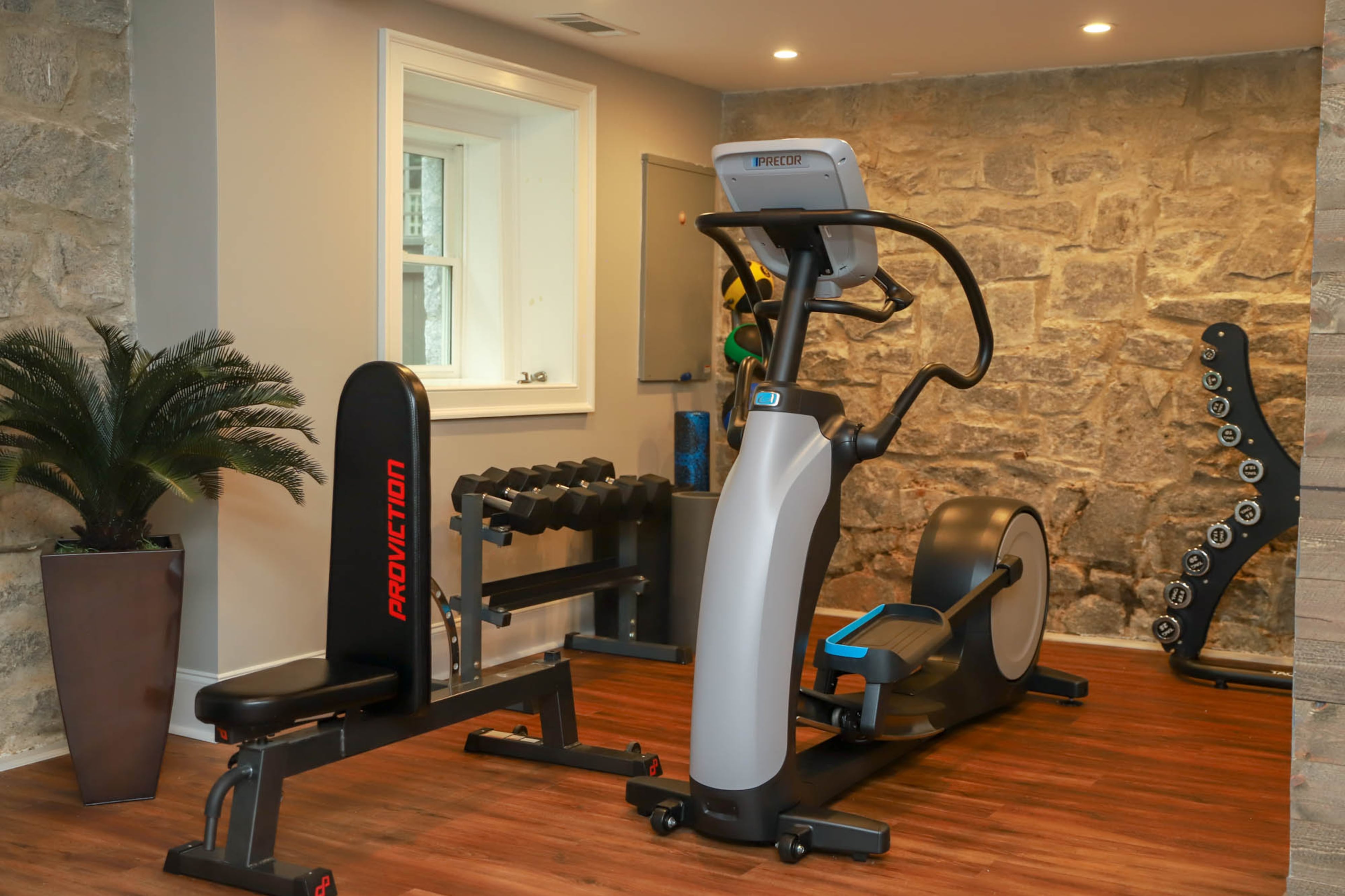 When previous homeowners completely rebuilt the house in the 1990s, all that was left of the original 1940s structure was the basement, which David Diehl and Jason Warshaw renovated when they bought their Fulton County home in 2016. They worked with Floor Coverings International to put in new flooring and gave the space fresh paint so that they could use it for a recreation space, gym and wine cellar.