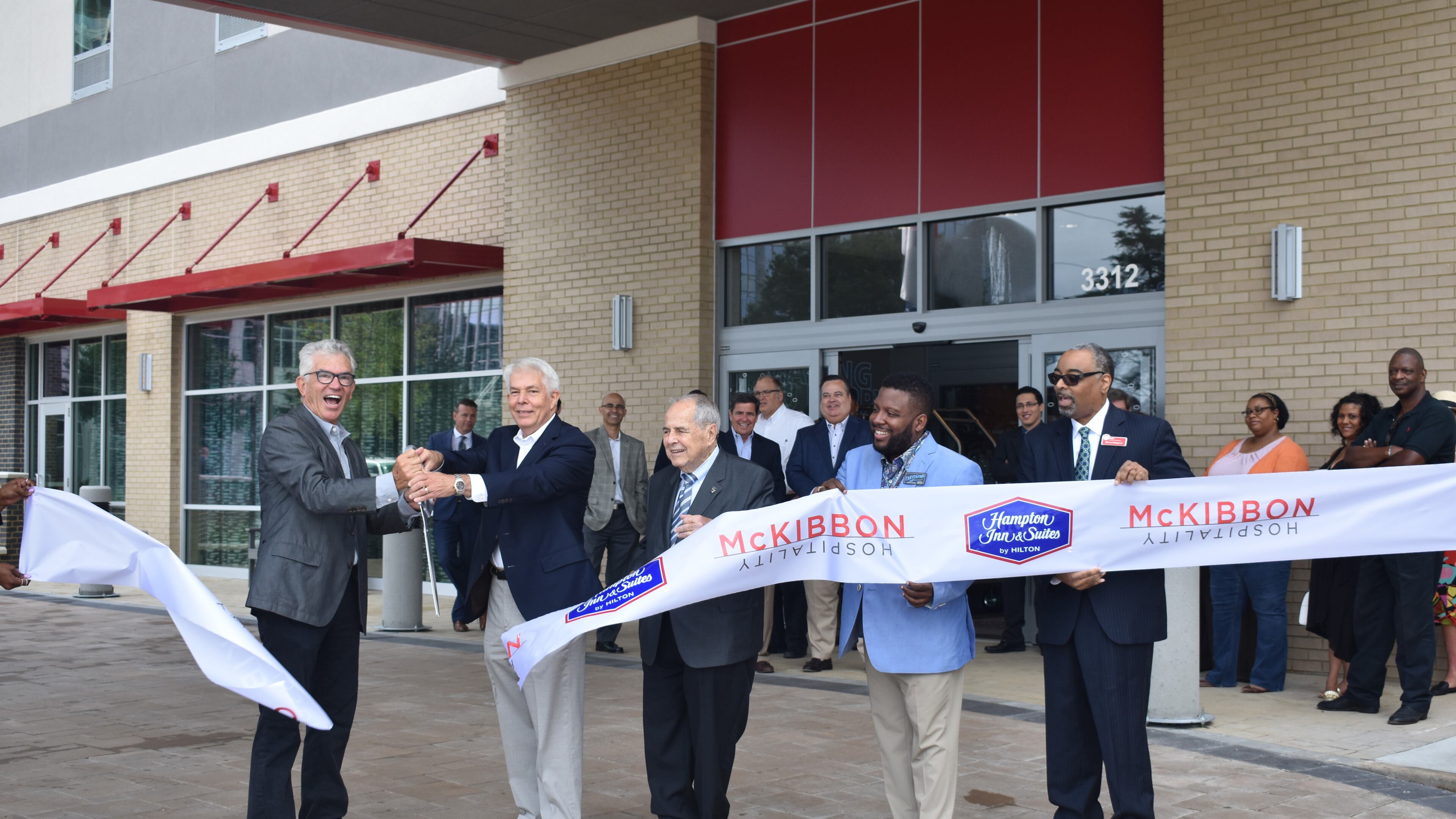 From left to right: John McKibbon, McKibbon Hospitality; John W. Lundeen III, Coro Realty Advisors; Sam Massell, Buckhead Coalition; Christopher Flanders, Hampton Inn & Suites Atlanta Buckhead; Marcus Margerum, Atlanta Convention and Visitors Bureau.