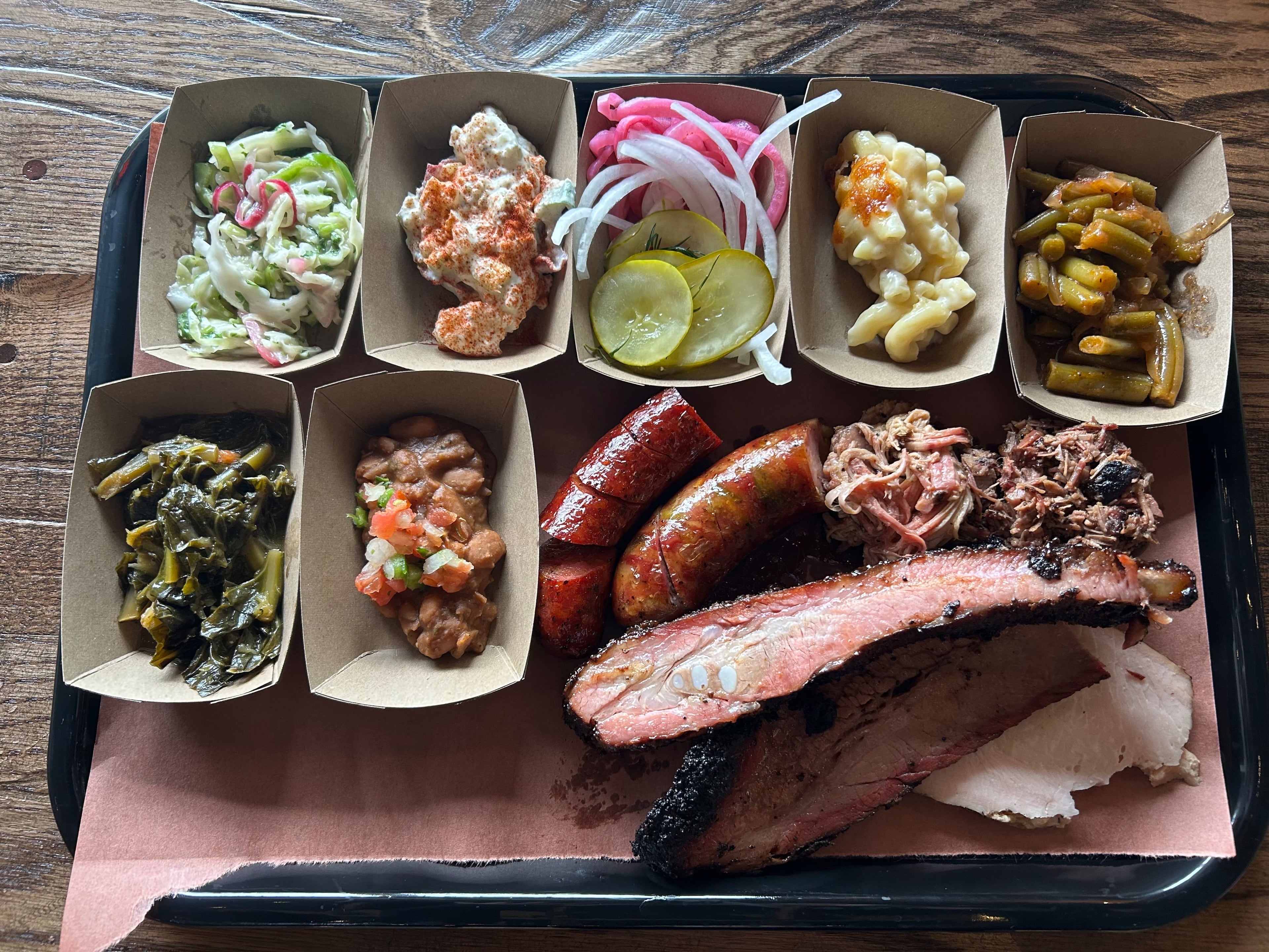 Lewis Barbecue opened in Ansley Mall Dec. 8 with a menu of Central Texas-style barbecue from pitmaster John Lewis and a variety of sides. (Olivia Wakim/AJC)