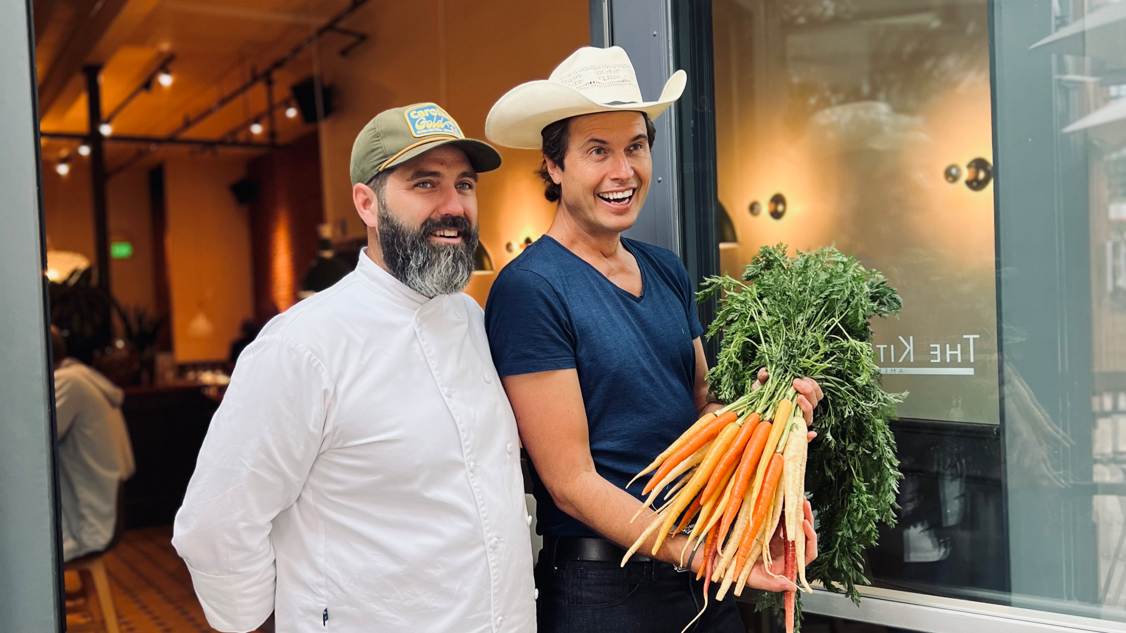Chef Michael Bertozzi and Kimbal Musk stand in front of The Kitchen, a chain of restaurants co-founded by Musk, based in Boulder, Colo. Musk and Bertozzi, a former executive chef at TWO Urban Licks, visited Atlanta March 14, 2024, for a book-signing event on the release of Musk's first cookbook, "The Kitchen Cookbook," at Virginia Highland Books.