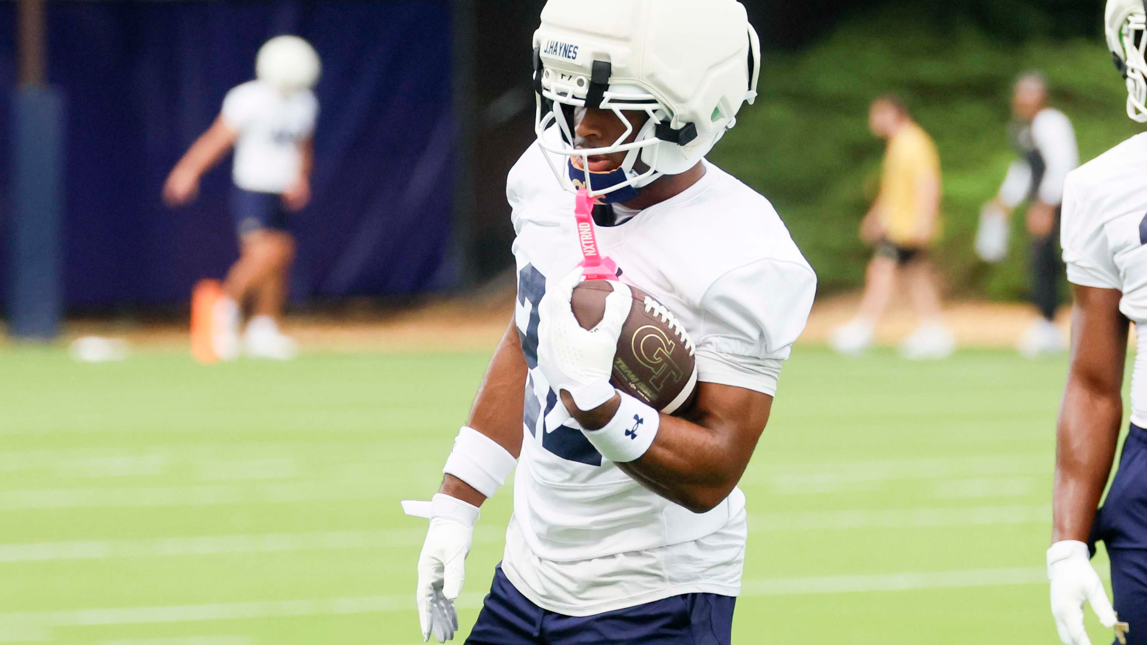 Georgia Tech running back Justice Haynes (22), left, holds the ball during the first day of football practice at Rose Bowl Field and the Mary and John Brock Football Practice Facility, Monday, August 3, 2025, in Atlanta. (Miguel Martinez/AJC)