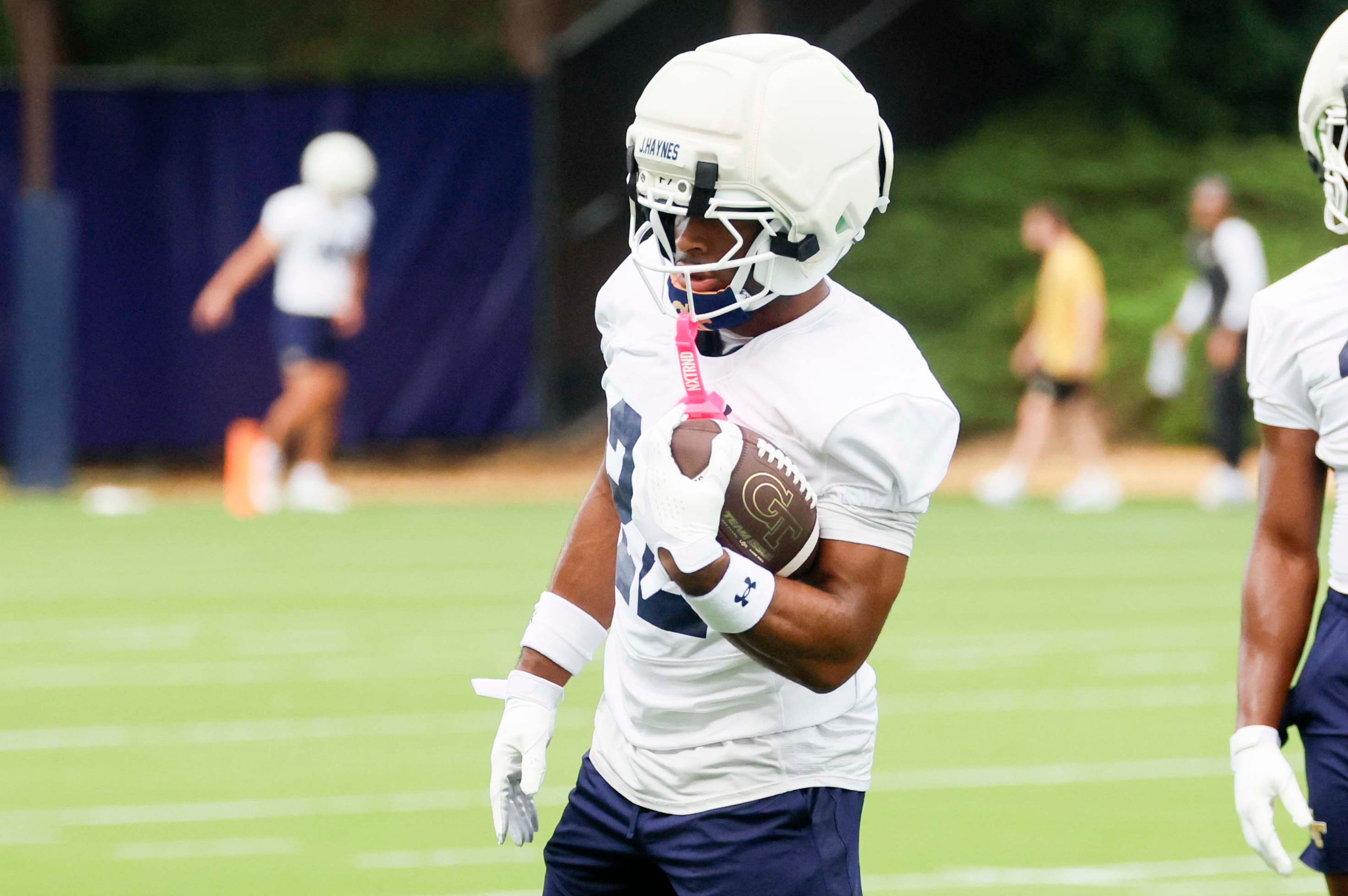 Georgia Tech running back Justice Haynes (22), left, holds the ball during the first day of football practice at Rose Bowl Field and the Mary and John Brock Football Practice Facility, Monday, August 3, 2025, in Atlanta. (Miguel Martinez/AJC)