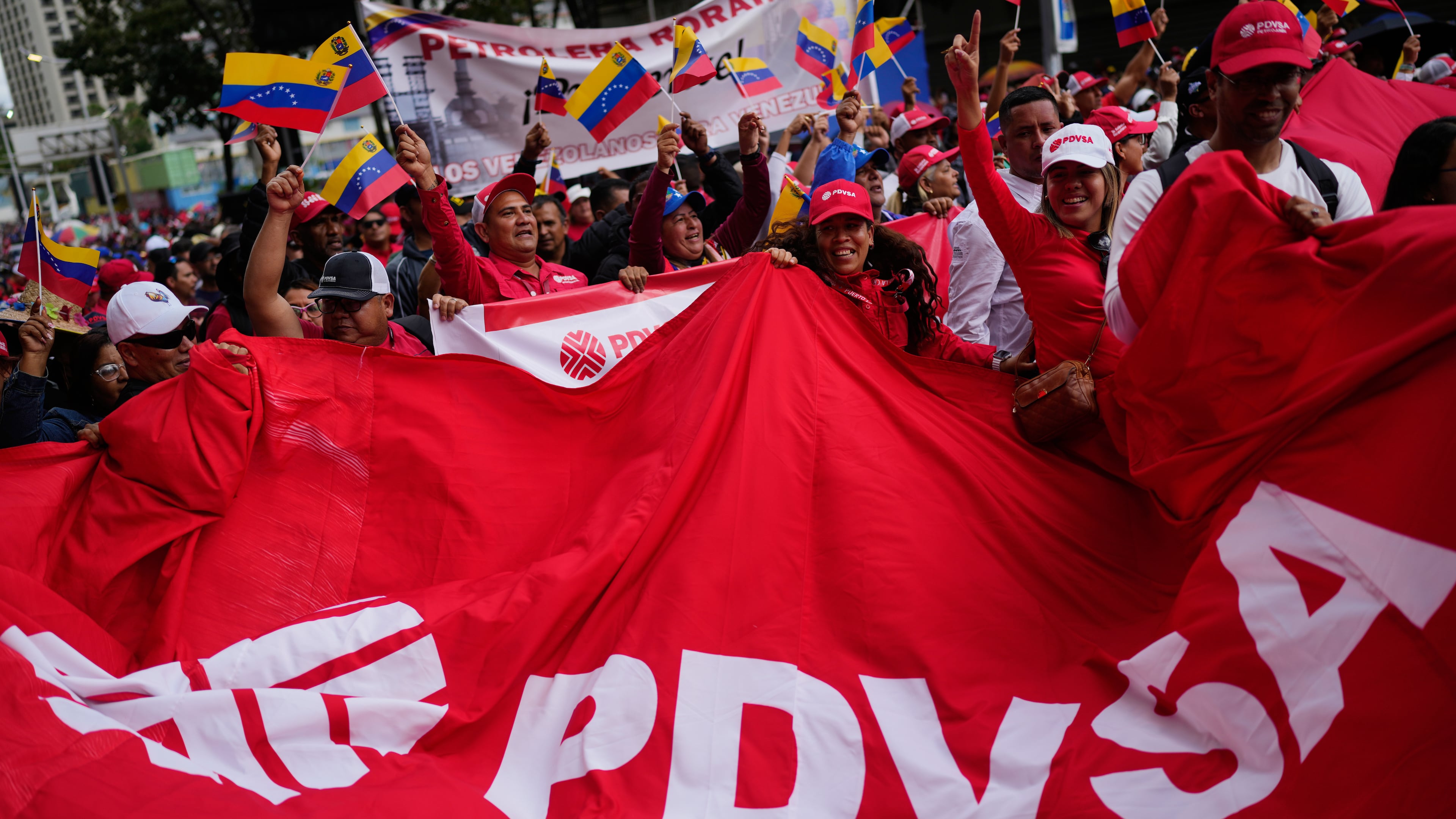 Workers of Venezuela's state-owned PDVSA oil company rally to back an oil reform bill proposed by acting President Delcy Rodriguez to loosen state control and open the industry to private and foreign investment in Caracas, Venezuela, Thursday, Jan. 29, 2026. (AP Photo/Ariana Cubillos)