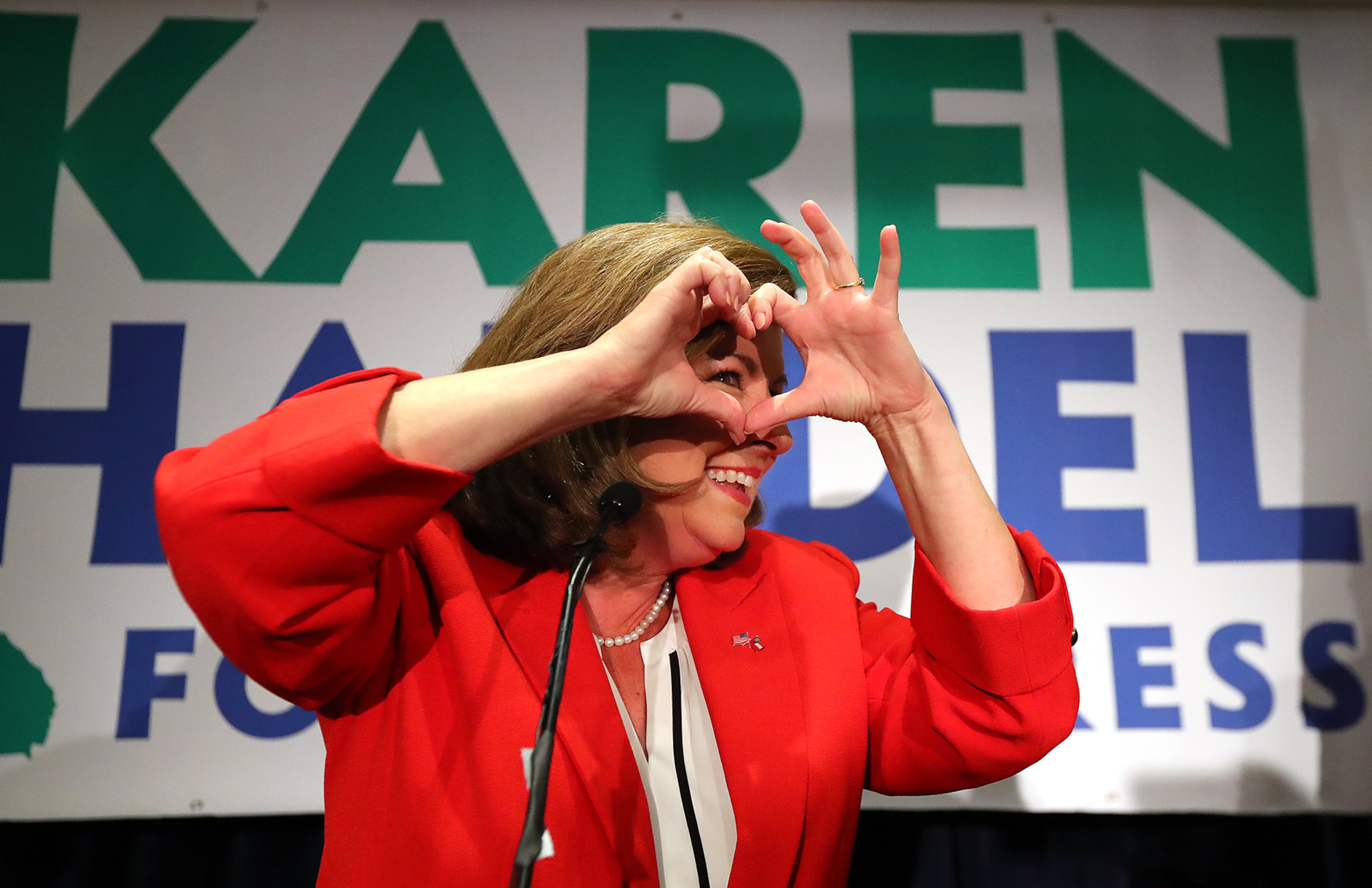 June 20, 2017, Atlanta: Karen Handel makes a heart symbol while making an early appearance to thank her supporters after the first returns came in during her election night party in the 6th District race with Jon Ossoff on Tuesday, June 20, 2017, in Atlanta. Curtis Compton/ccompton@ajc.com