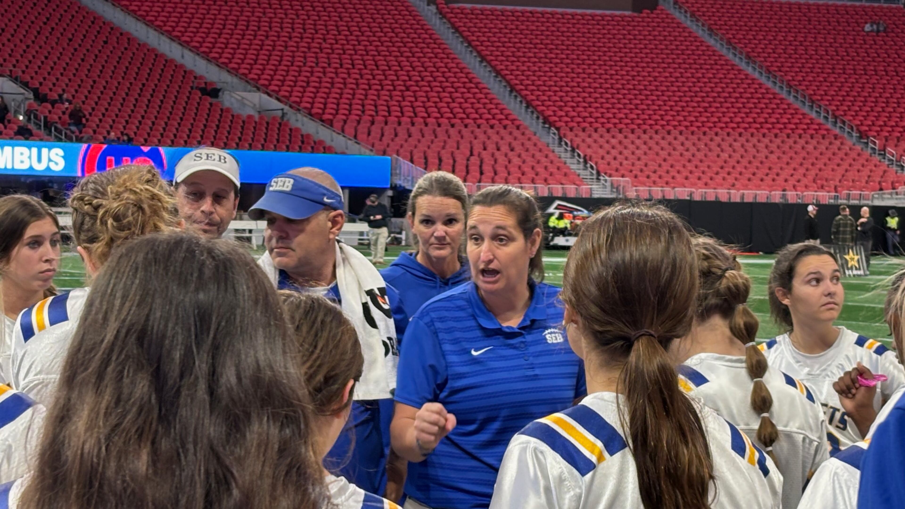 Southeast Bulloch coach Marci Cochran talks to her players during the Division 1 championship game on Dec. 16 at Mercedes-Benz Stadium. Southeast beat Columbus 13-6 in overtime to win its fourth consecutive state championship.