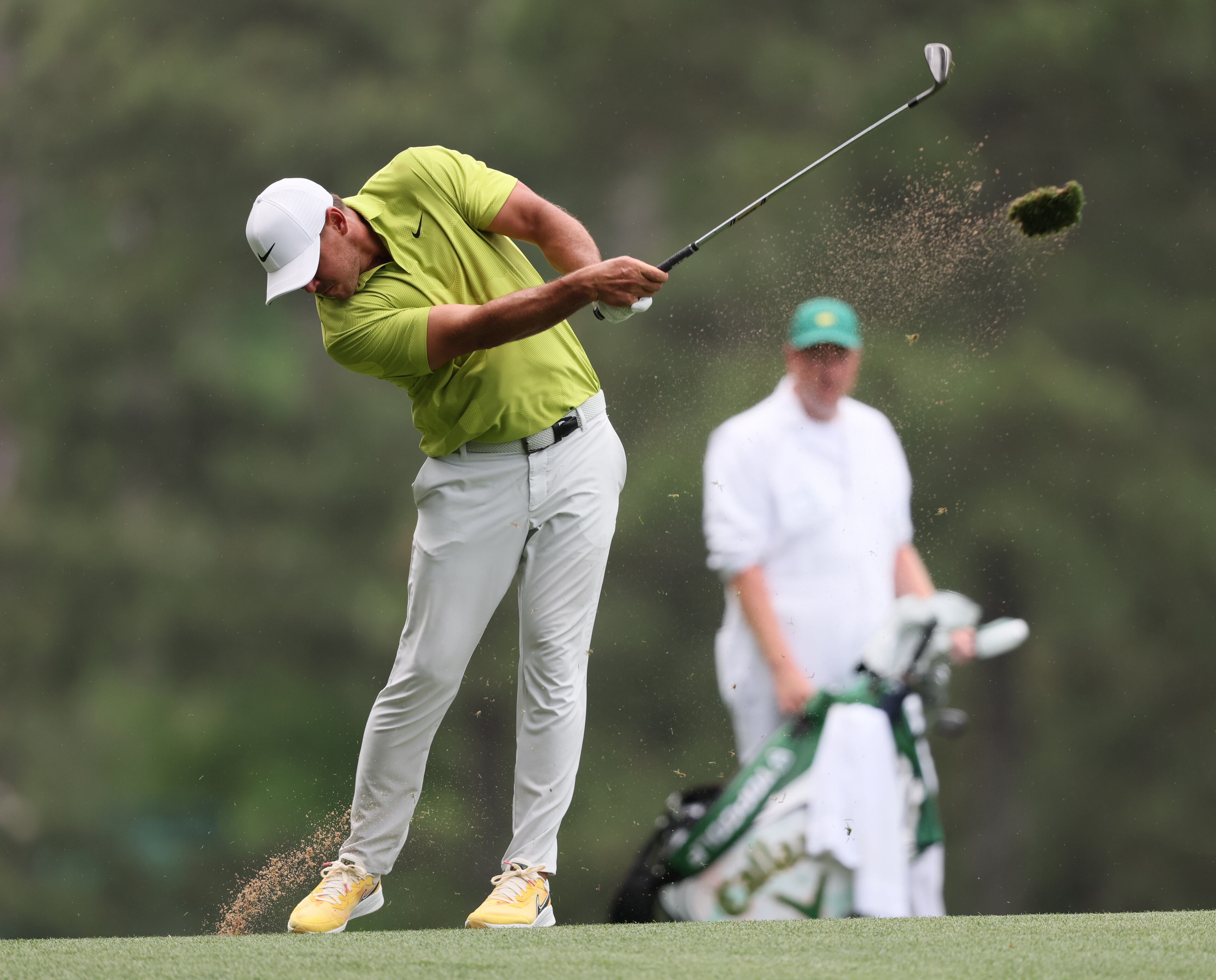 Brooks Koepka hits second shot on 14th hole during first round of the 2023 Masters Tournament at Augusta National Golf Club, Thursday, April 6, 2023, in Augusta, Ga. (Jason Getz / Jason.Getz@ajc.com)