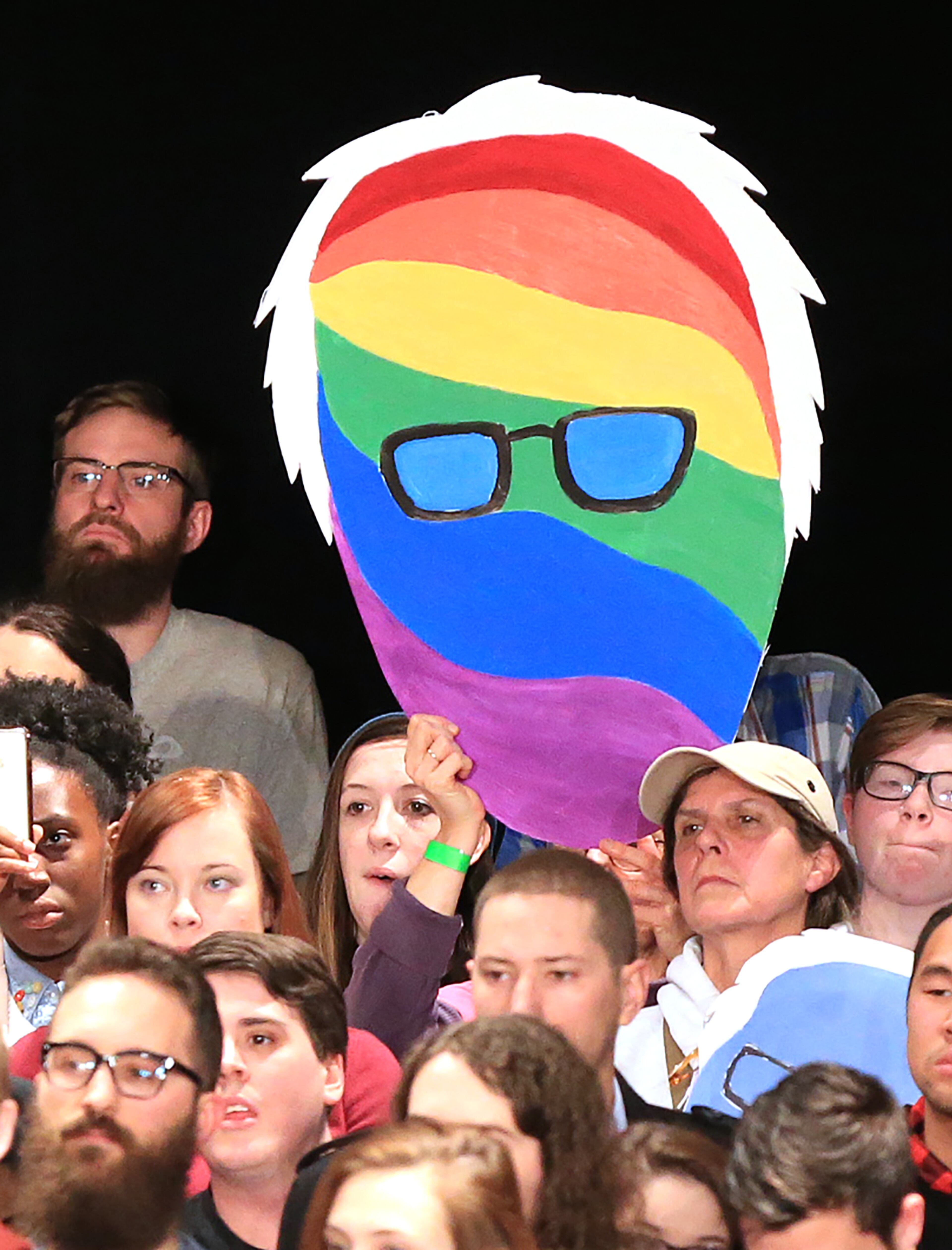 A member of the crowd holds a likeness of Democratic presidential candidate Bernie Sanders as he speaks to the packed crowd filling the Fox Theatre on Monday, Nov. 23, 2015, in Atlanta. Curtis Compton / ccompton@ajc.com