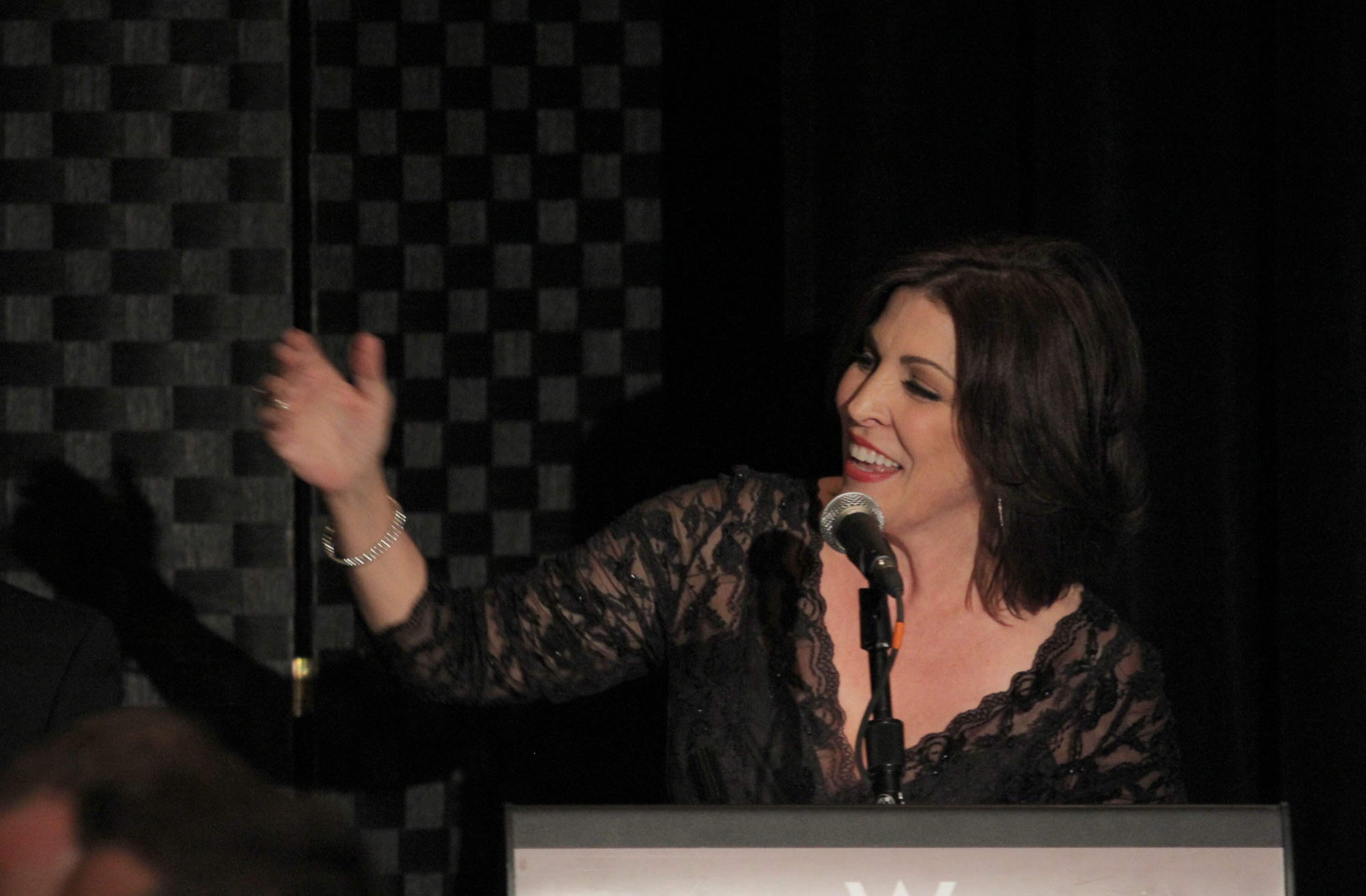 Michele Caplinger, senior executive director of the Recording Academy Atlanta Chapter introduces Grammy-winning artist Cee Lo and Little Richard for the debut of The Legacy Lounge presented by The Recording Academy Atlanta Chapter, at the W Atlanta Downtown Sunday, Sept. 30, 2013.