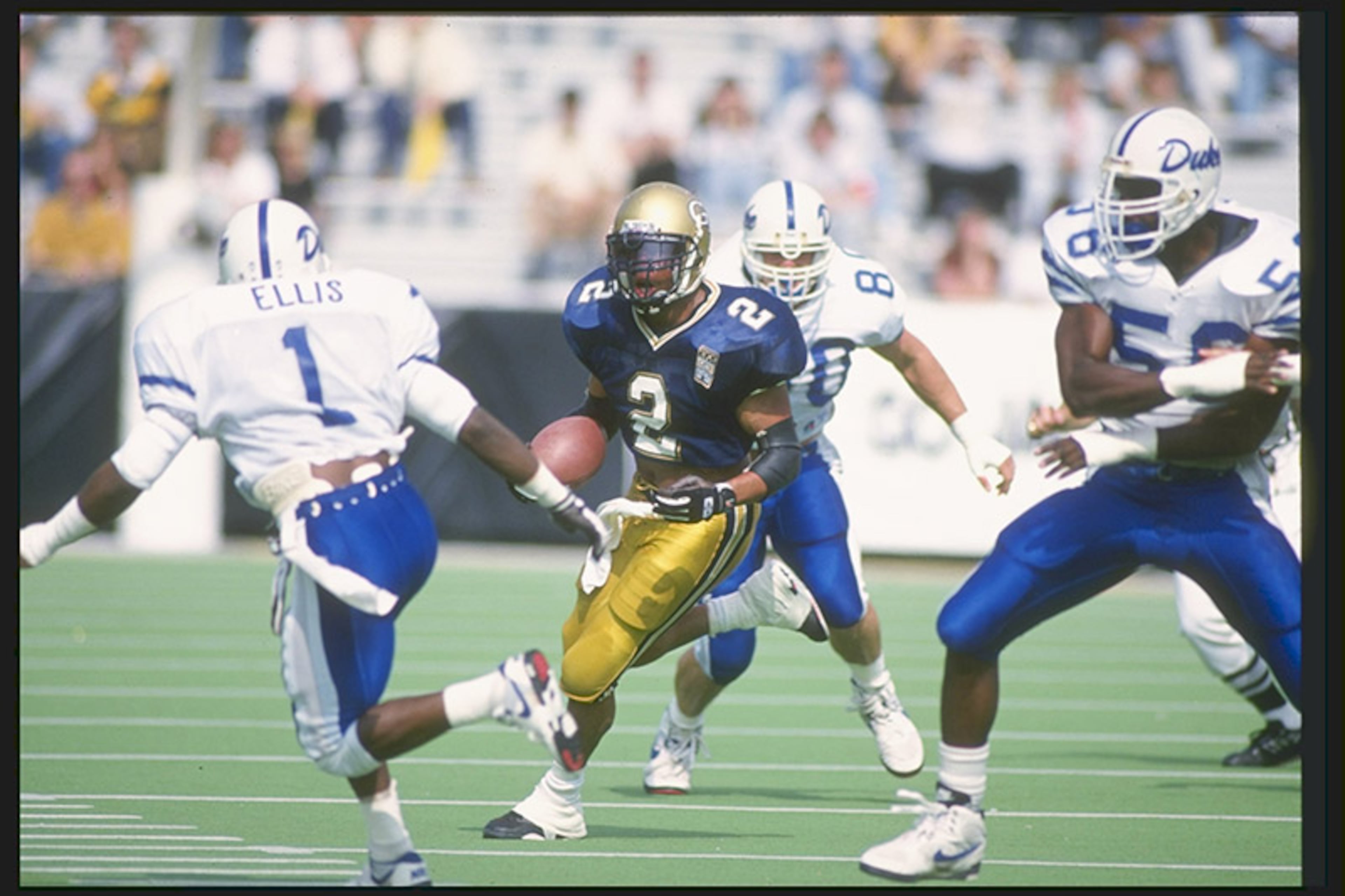 Periodically from 1987 until 1994, Georgia Tech’s home jersey was navy blue, worn with gold pants. The look was reminiscent of the 1940s teams, which also wore navy blue jerseys with gold pants at Grant Field.