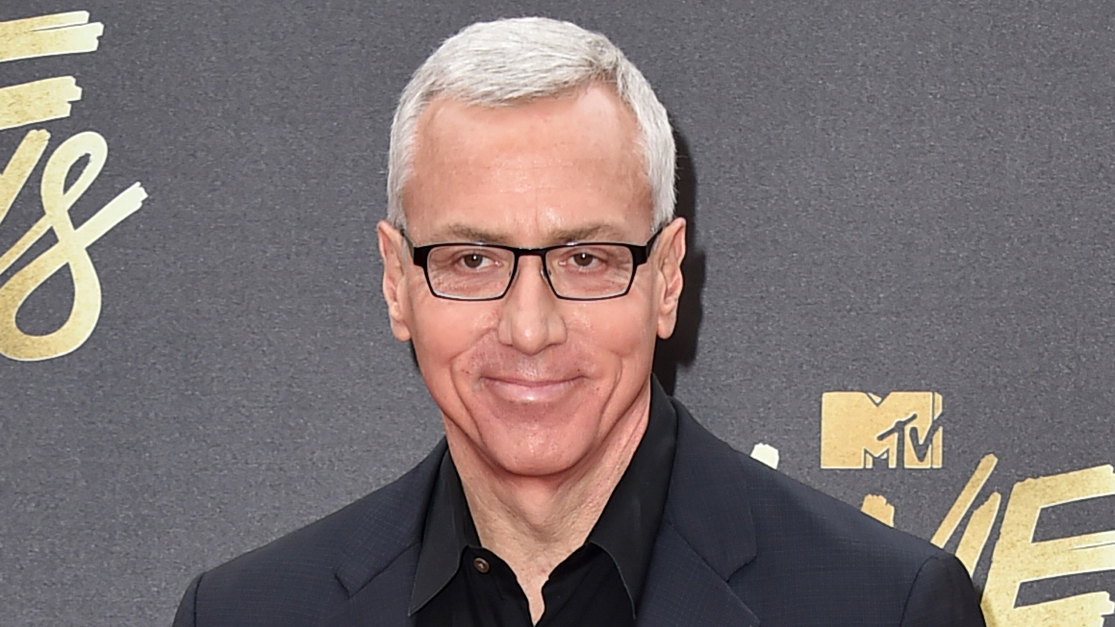 FILE - In this April 9, 2016 file photo, Drew Pinsky arrives at the MTV Movie Awards in Burbank, Calif. Pinsky's show "Dr. Drew," has been canceled by the HLN network. His last episode will air on Sept. 22. (Photo by Jordan Strauss/Invision/AP, File)