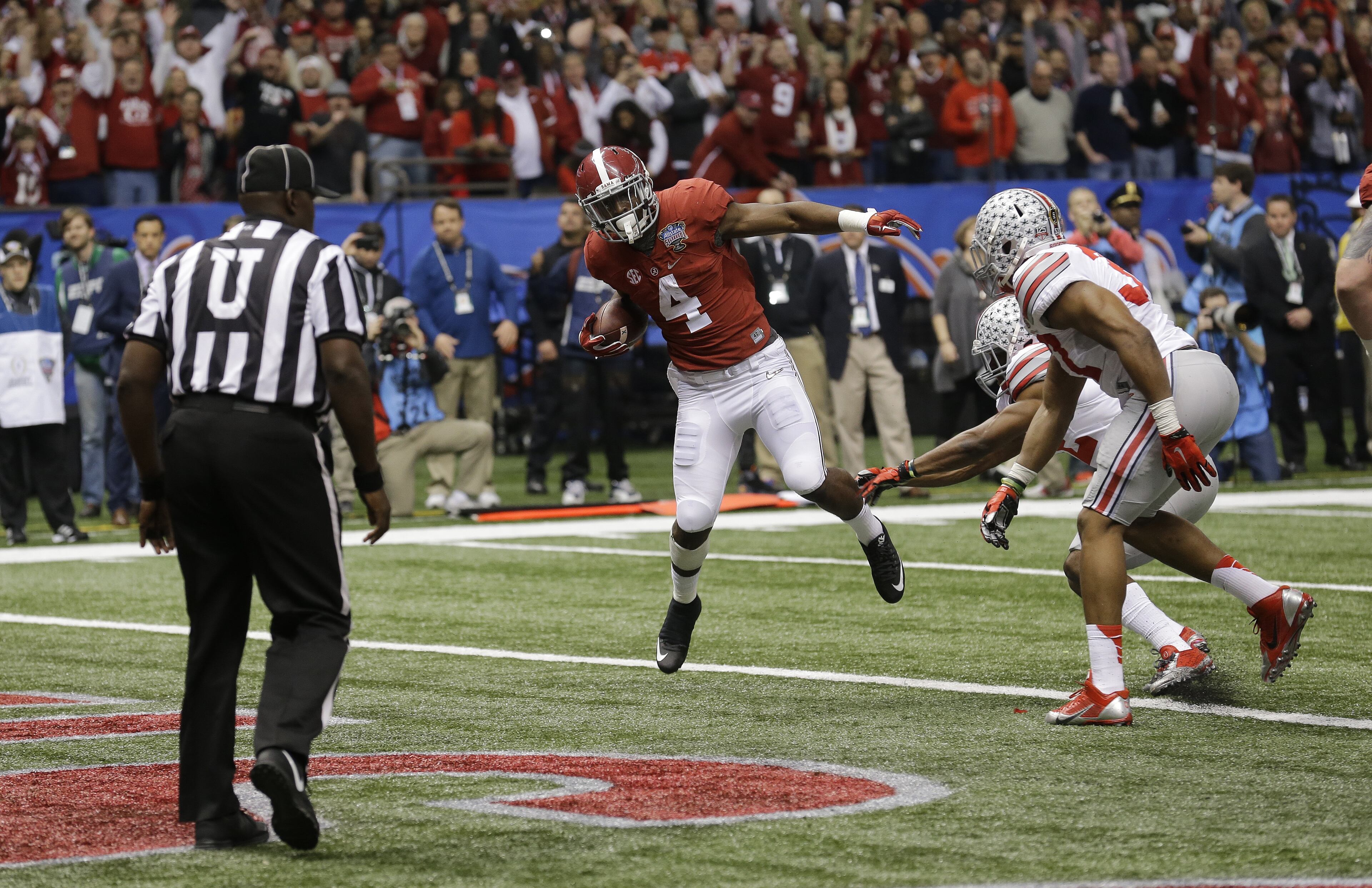 Alabama running back T.J. Yeldon (4) runs into the end zone for a touchdown against Ohio State in the first half of the Sugar Bowl NCAA college football playoff semifinal game, Thursday, Jan. 1, 2015, in New Orleans. (AP Photo/Bill Haber)