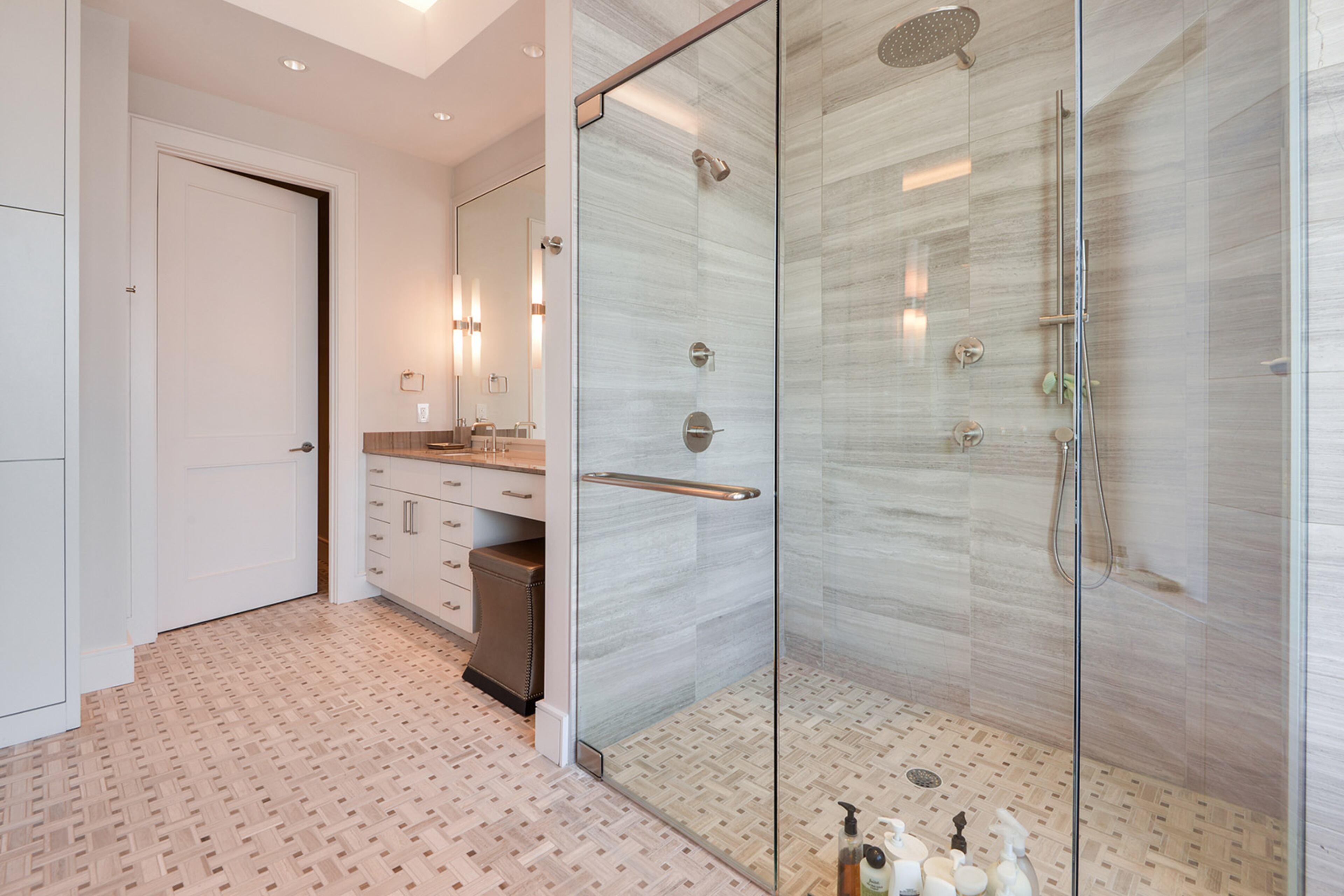 The primary bath has a shower featuring a rain shower head.