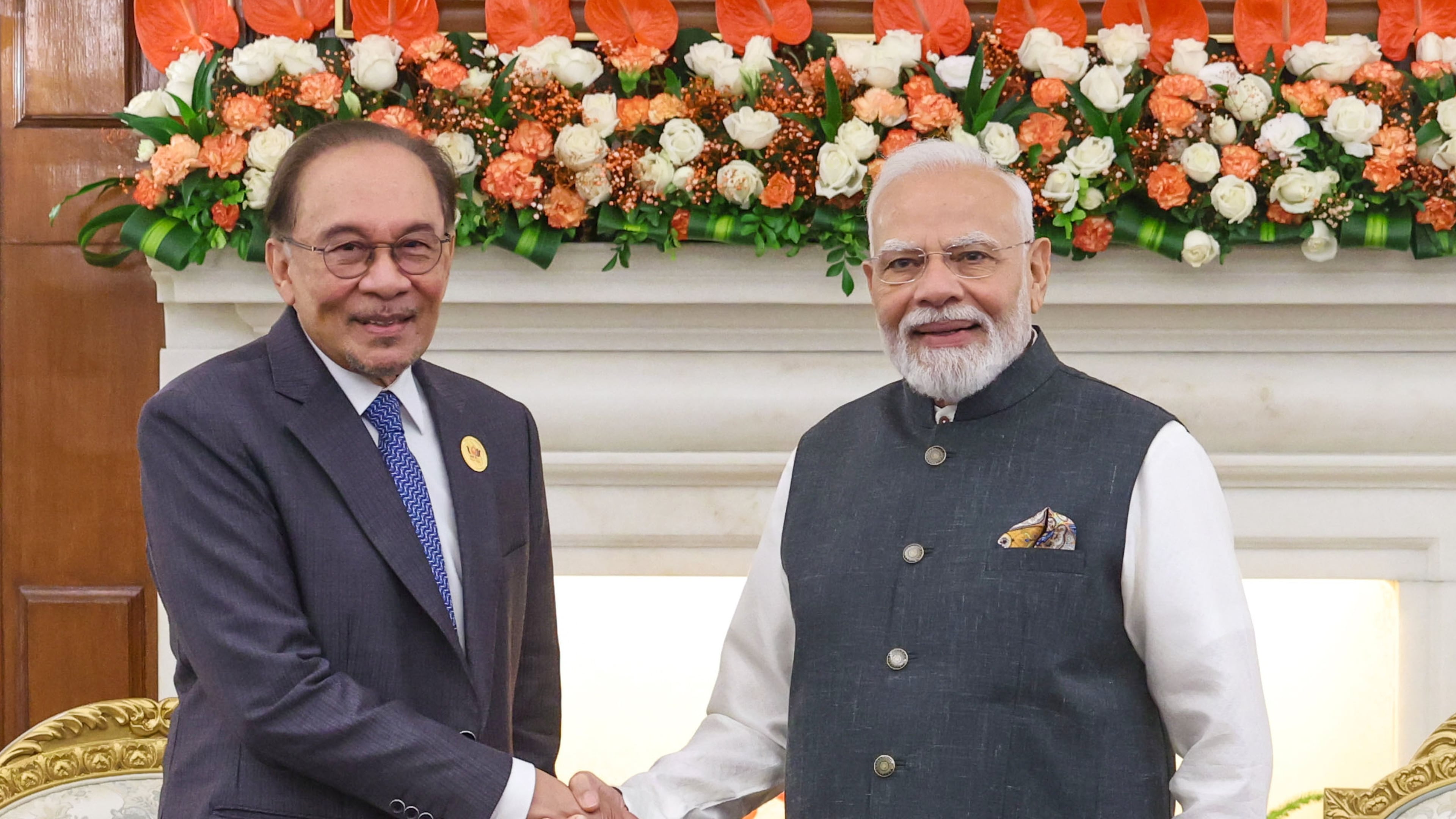 Indian Prime Minister Narendra Modi, right, shakes hand with Prime Malaysian Prime Minister Anwar Ibrahim, during a meeting on the sidelines of the BRICS Summit in New Delhi, India, Saturday, Sept. 12, 2026. (Indian Prime Minister's Office via AP )