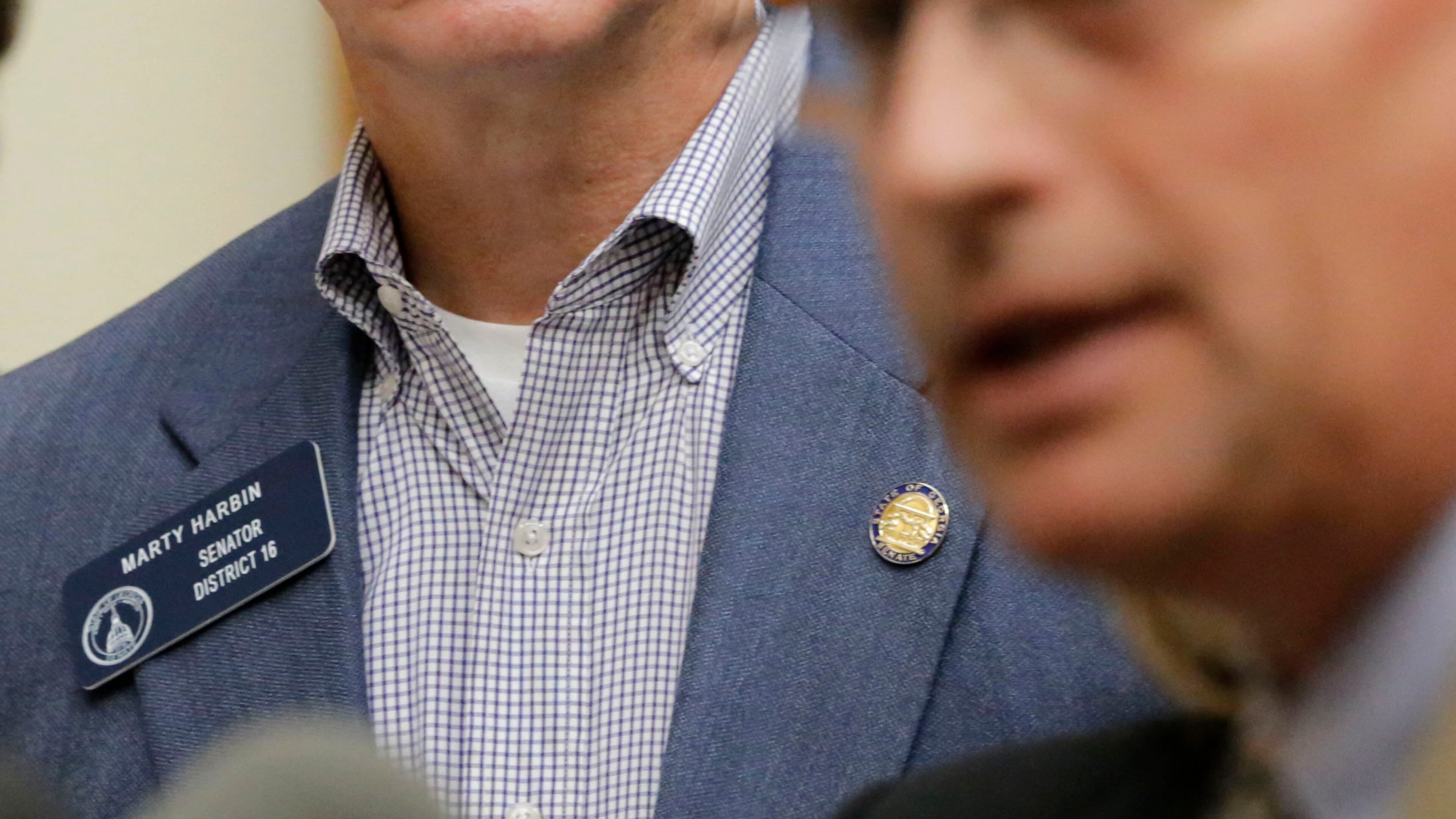 State Sen. Marty Harbin (left), looks on as Mike Griffin of the Georgia Baptist Mission Board speaks about the "religious liberty" legislation in 2016. BOB ANDRES / BANDRES@AJC.COM