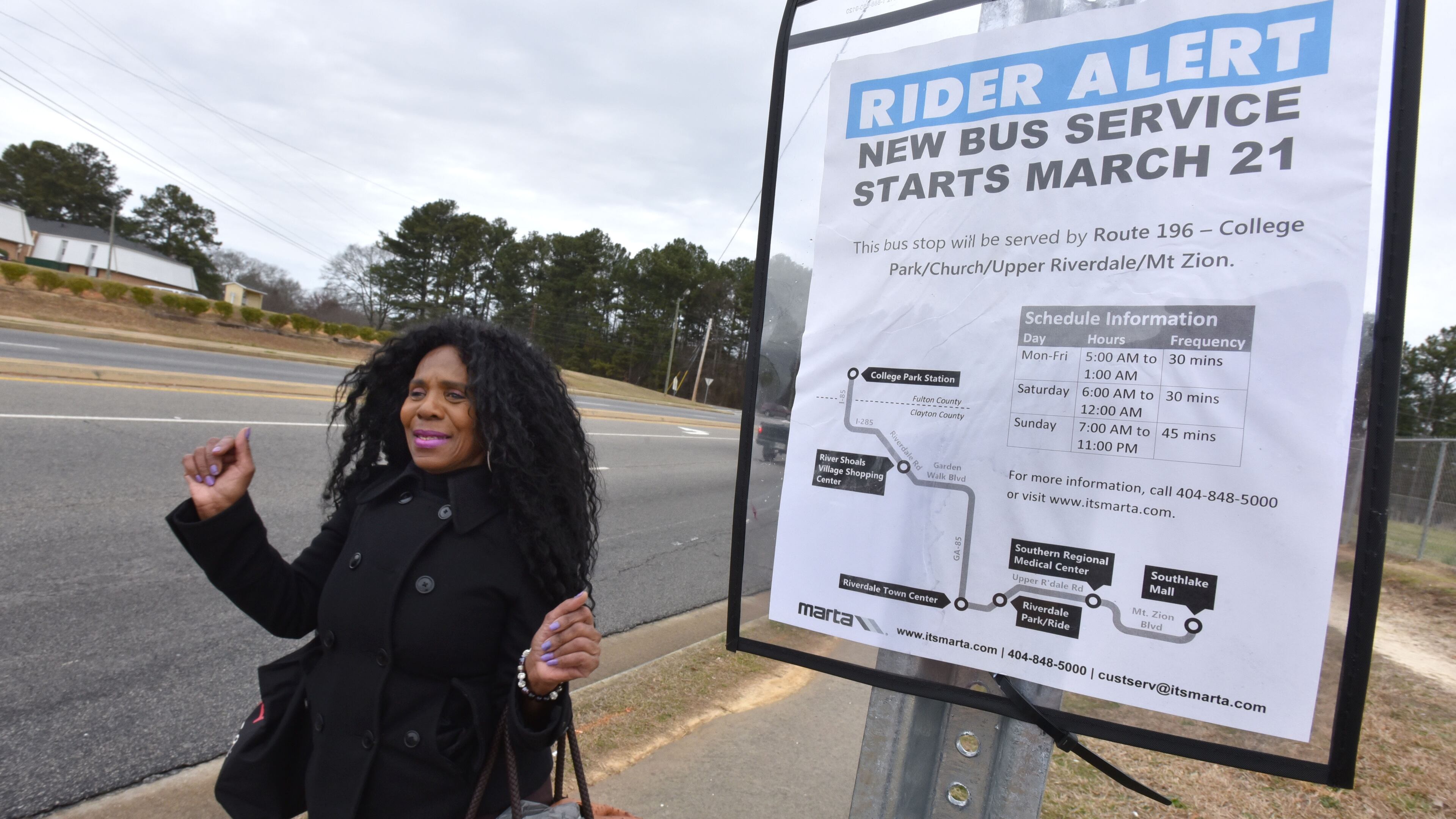 March 10, 2015 Riverdale - Brenda Crook celebrates as she walks past new bus stop on her way back home after her grocery shopping in Riverdale on Tuesday, March 10, 2015. If anyone has come to embody Clayton's pro-transit movement, it's Brenda "Inka" Crook. The 65-year-old Riverdale resident was the shoeleather advocate during the county's push to revive MARTA. Crook has been without transportation since Clayton pulled the plug on C-Tran five years ago this month. HYOSUB SHIN / HSHIN@AJC.COM