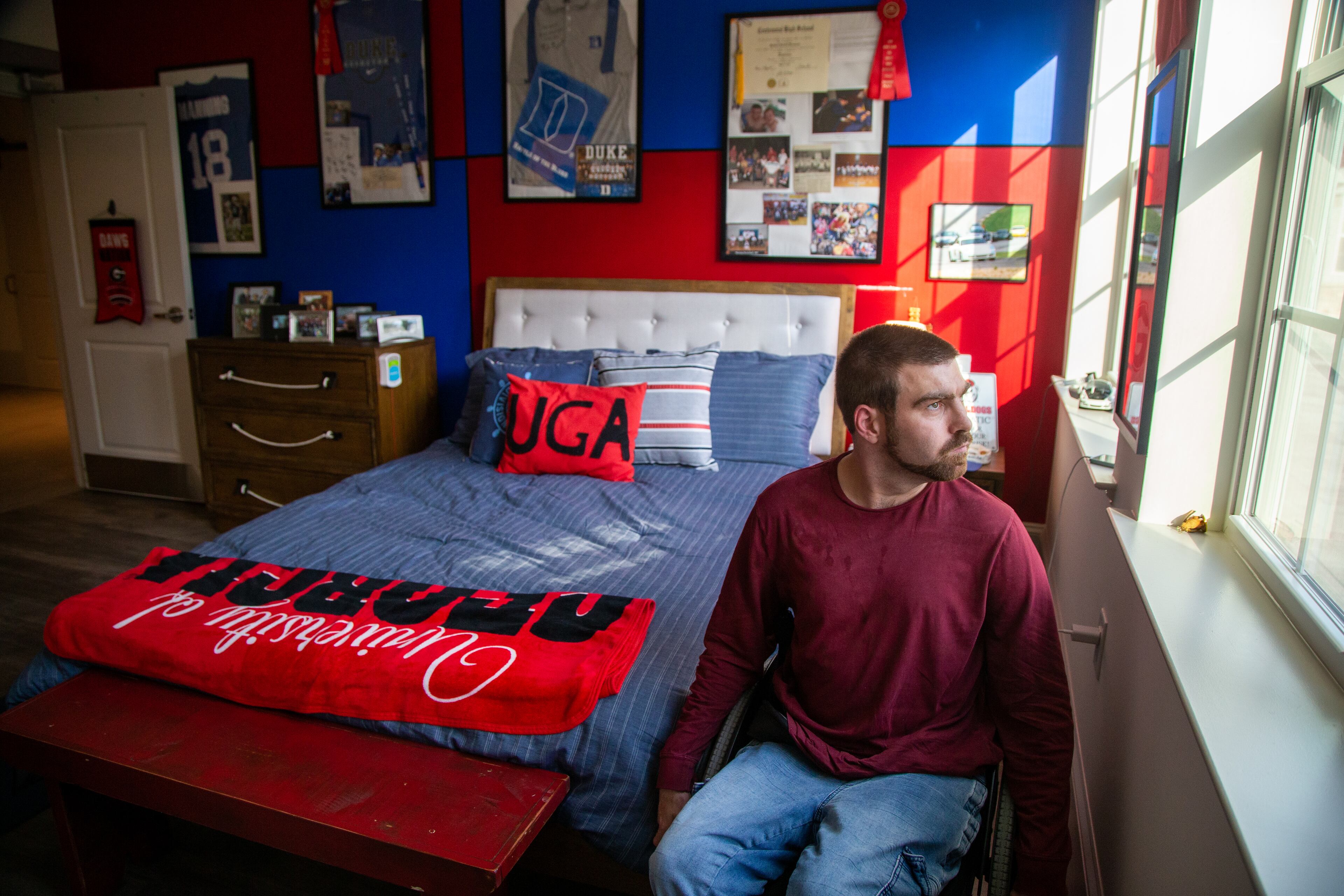 Matt Thompson looks out the window in his room at Champions Place. PHIL SKINNER FOR THE ATLANTA JOURNAL-CONSTITUTION.