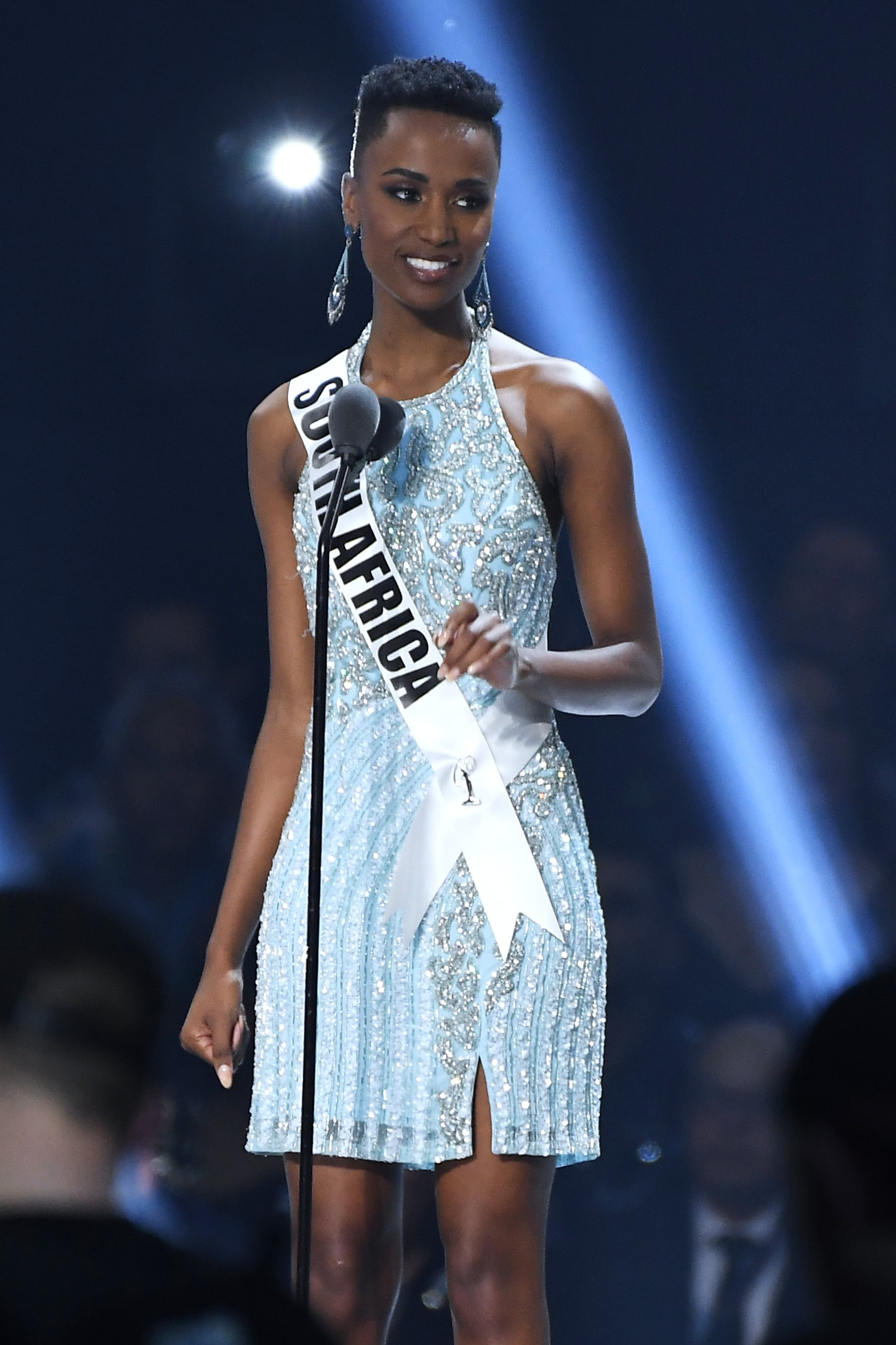 ATLANTA, GEORGIA - DECEMBER 08: (EDITORIAL USE ONLY) Miss South Africa Zozibini Tunzi speaks onstage at the 2019 Miss Universe Pageant at Tyler Perry Studios on December 08, 2019 in Atlanta, Georgia. (Photo by Paras Griffin/Getty Images)