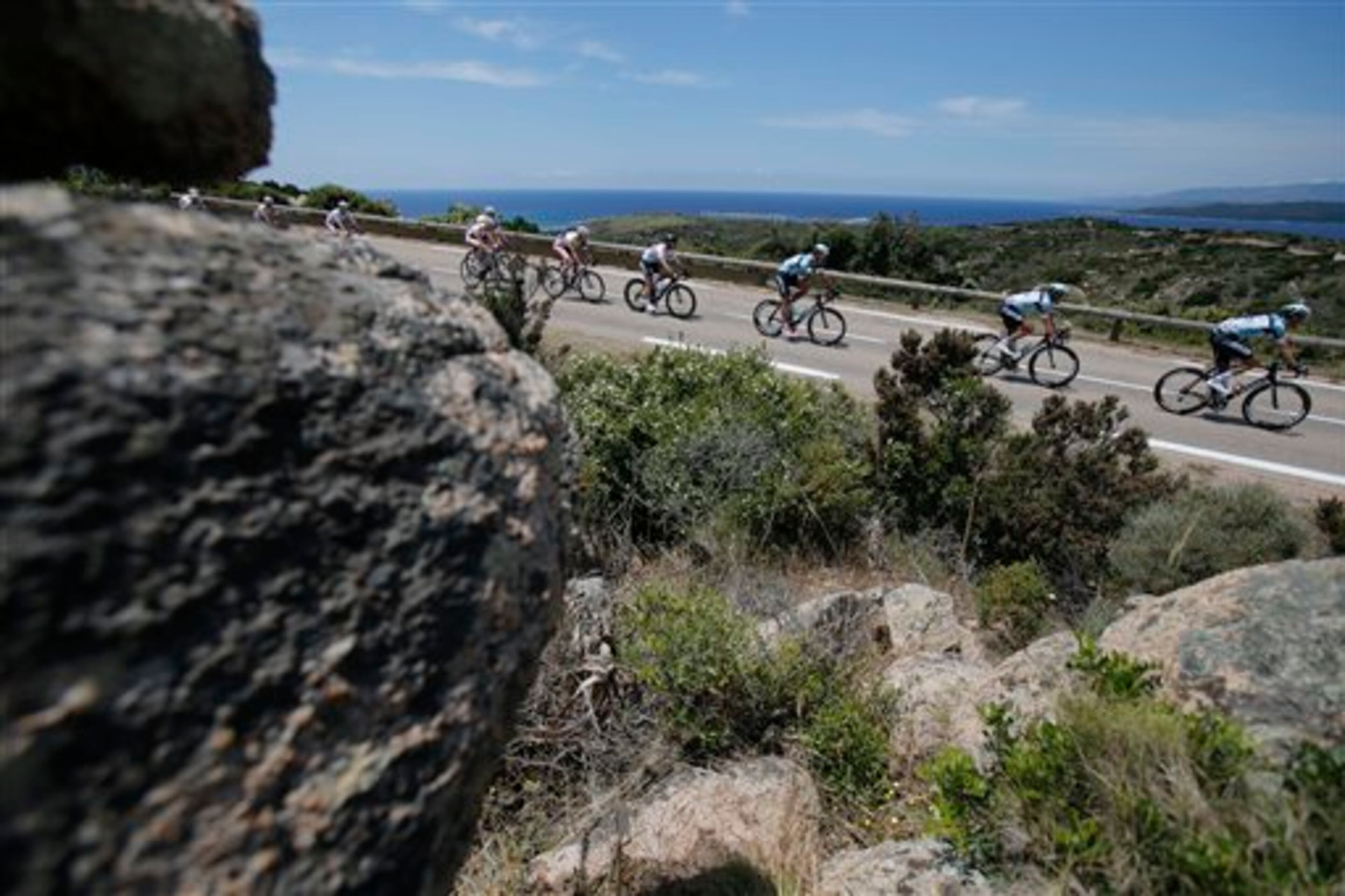 The pack with British sprinter Mark Cavendish in fourth position rides along the coast line of the Mediterranean Sea during the first stage of the 100th edition of the Tour de France cycling race over 213 kilometers (133 miles) with start in Porto Vecchio and finish in Bastia, Corsica island, France, Saturday June 29, 2013.(AP Photo/Christophe Ena)