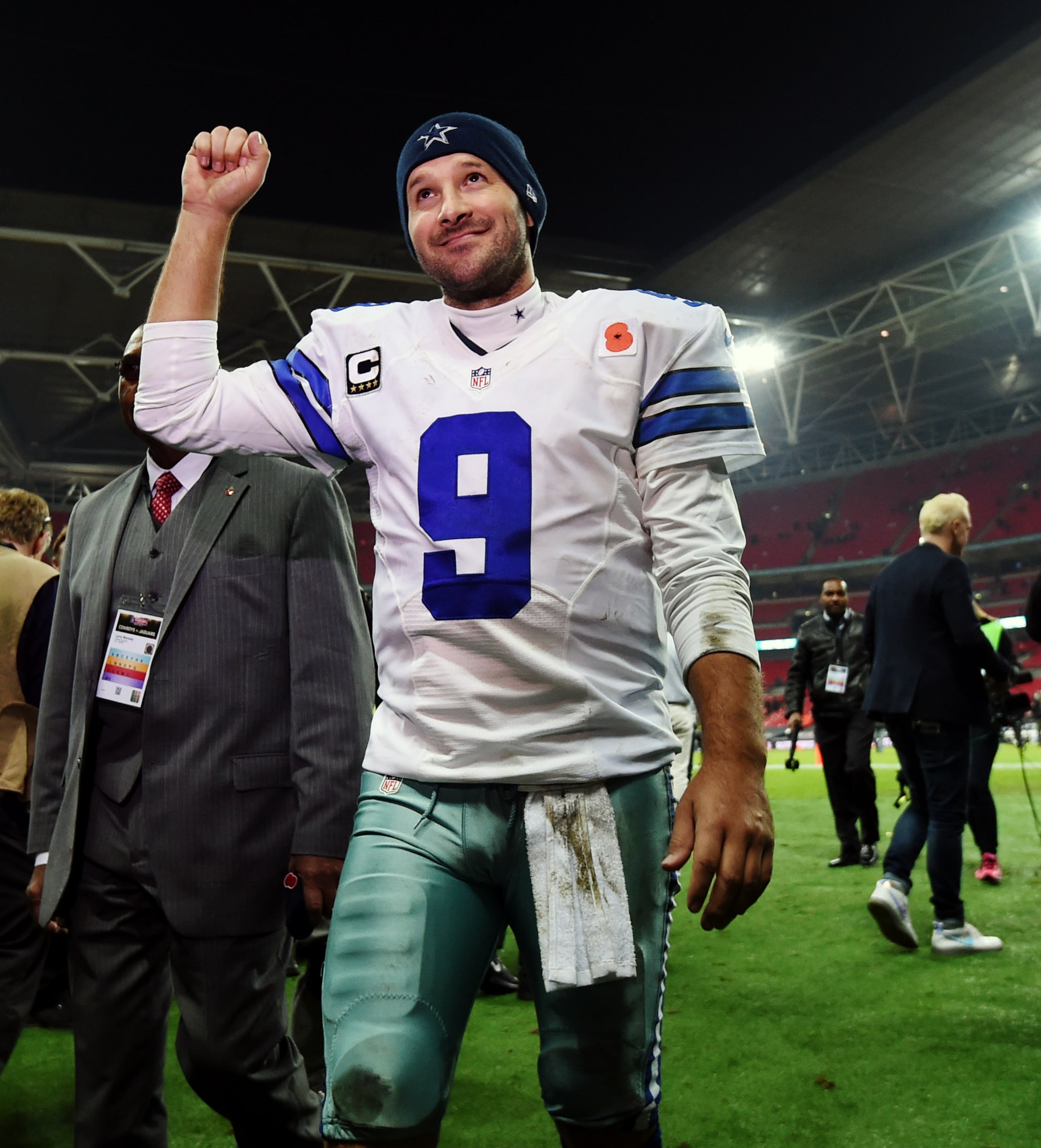 Dallas Cowboys quarterback Tony Romo acknowledges spectators after their 31-17 victory over the Jacksonville Jaguars during the NFL football game at Wembley Stadium, London, Sunday, Nov. 9, 2014. (AP Photo/Tim Ireland)