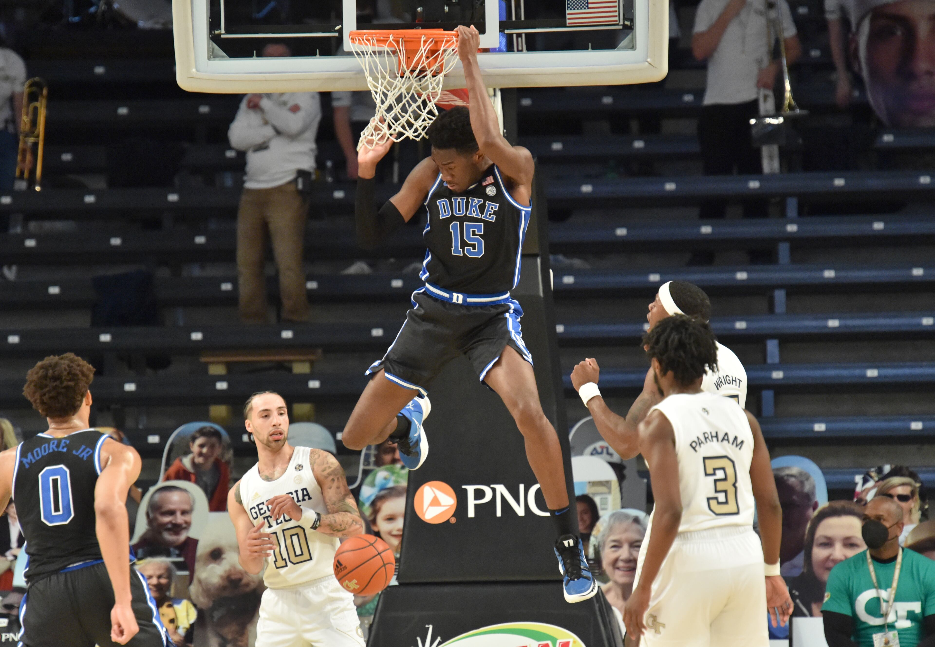 Duke forward Jaemyn Brakefield (5) hangs on the basket after dunking the ball in the second half. (Hyosub Shin / Hyosub.Shin@ajc.com)