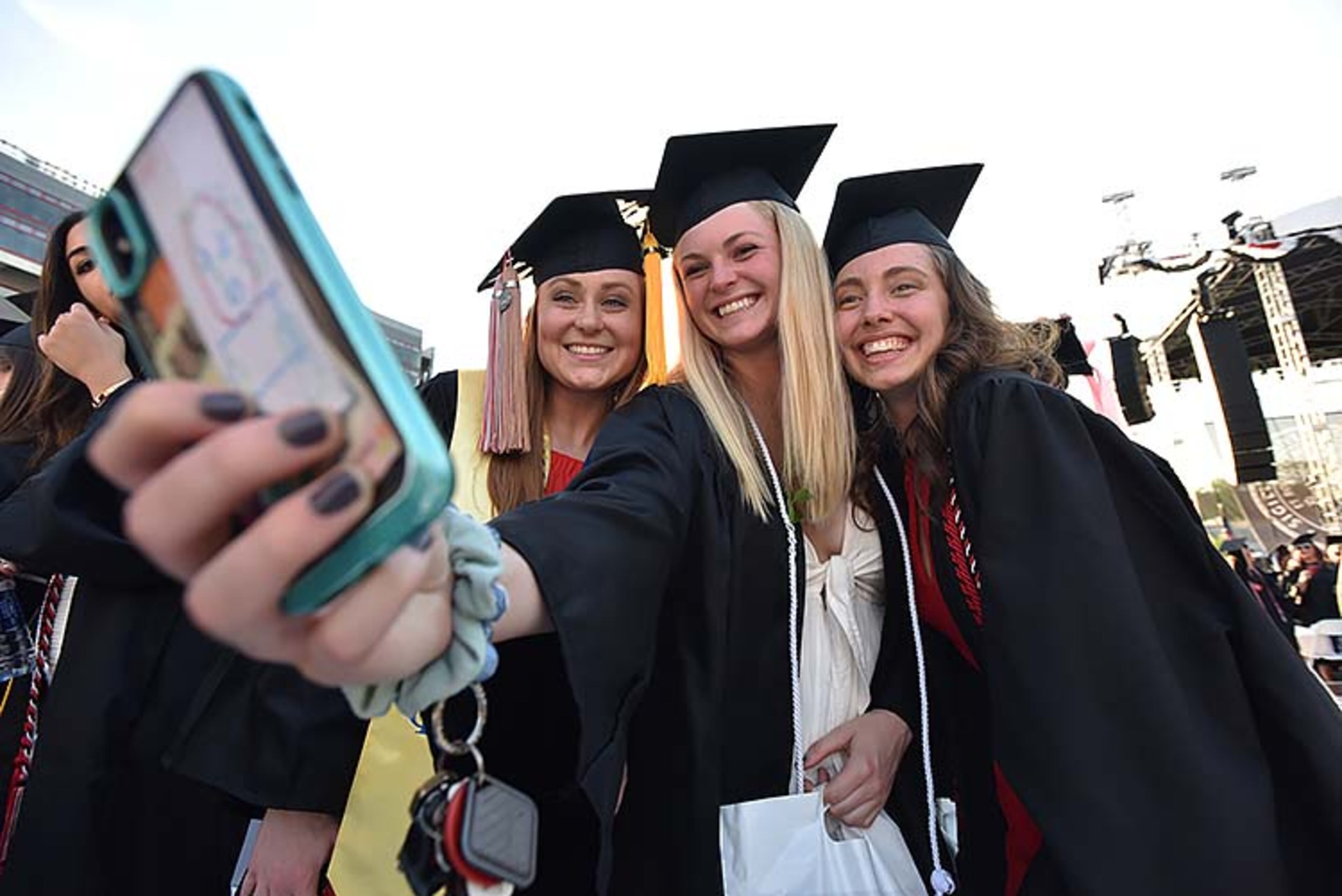 May 10, 2019 Athens - University of Georgia students (from left) CB Dryden, Sydney Versteeg and Jennifer Gramble take their selfies before 2019 spring undergraduate commencement ceremony at Sanford Stadium in Athens on Friday, May 10, 2019. HYOSUB SHIN / HSHIN@AJC.COM