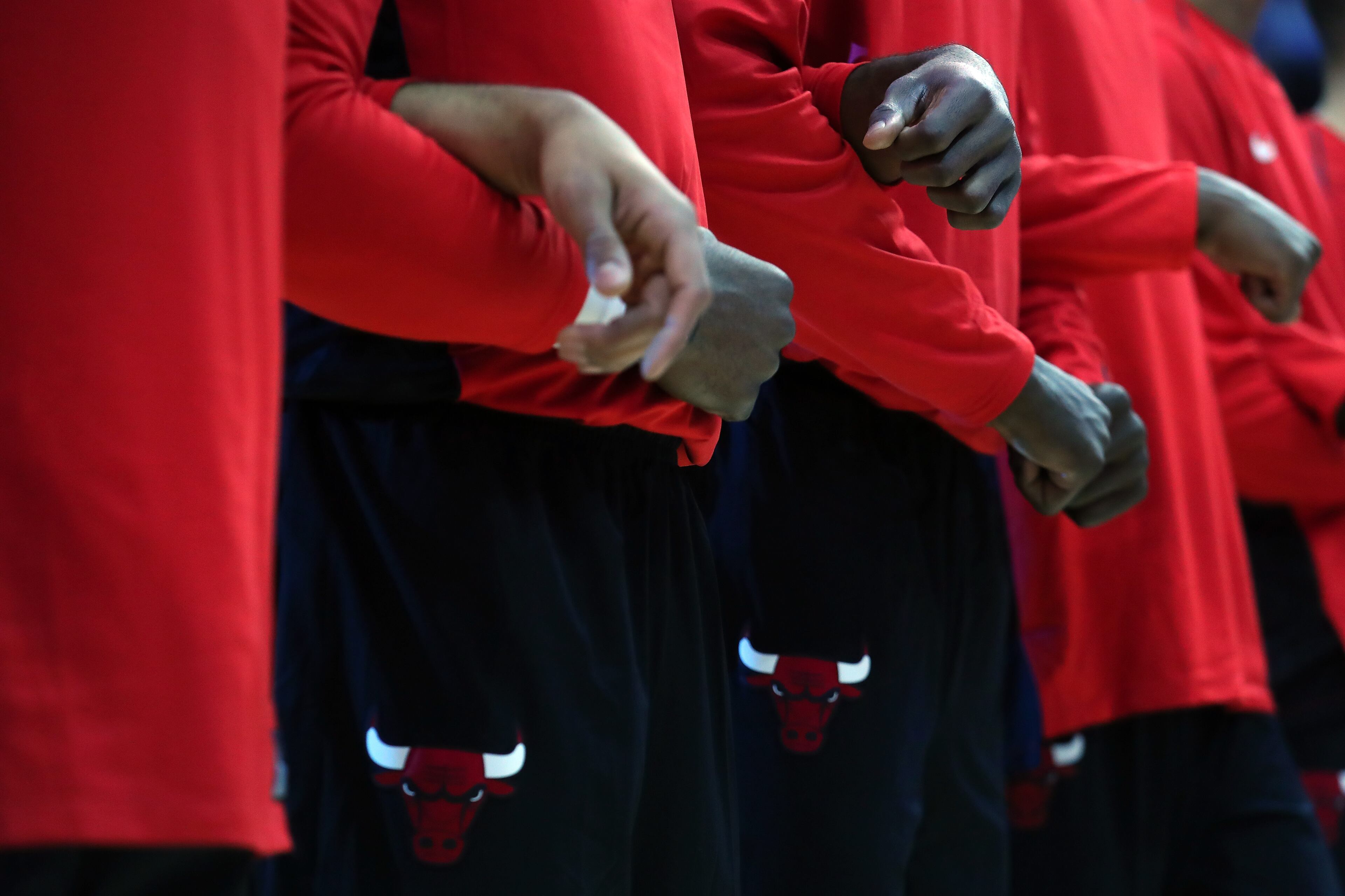 The Chicago Bulls stand and lock arms during the National Anthem prior to taking on the Dallas Mavericks at American Airlines Center on October 4.