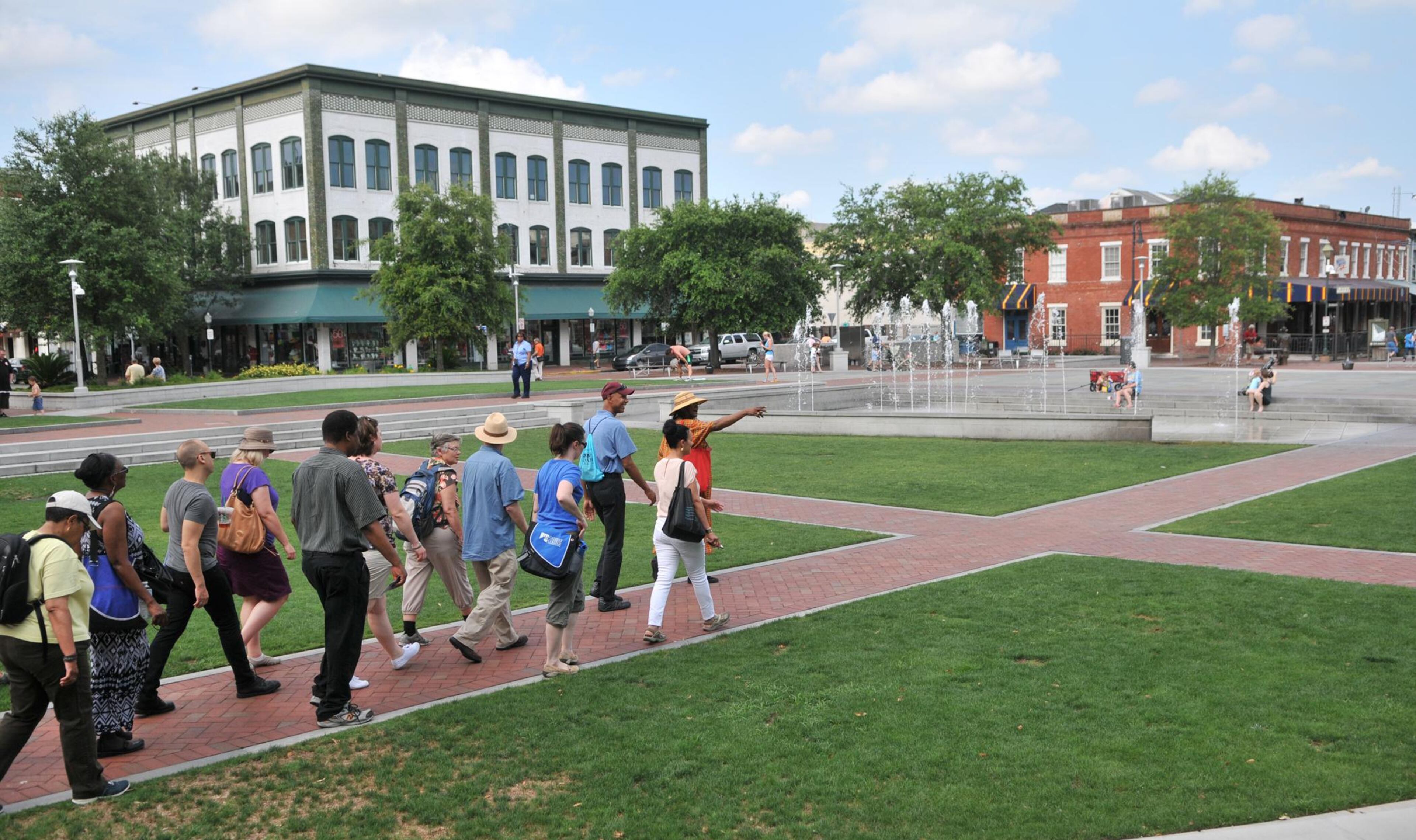 Vaughnette Goode-Walker, right, leads a group in a history tour through Ellis Square and downtown Savannah in this file photo.