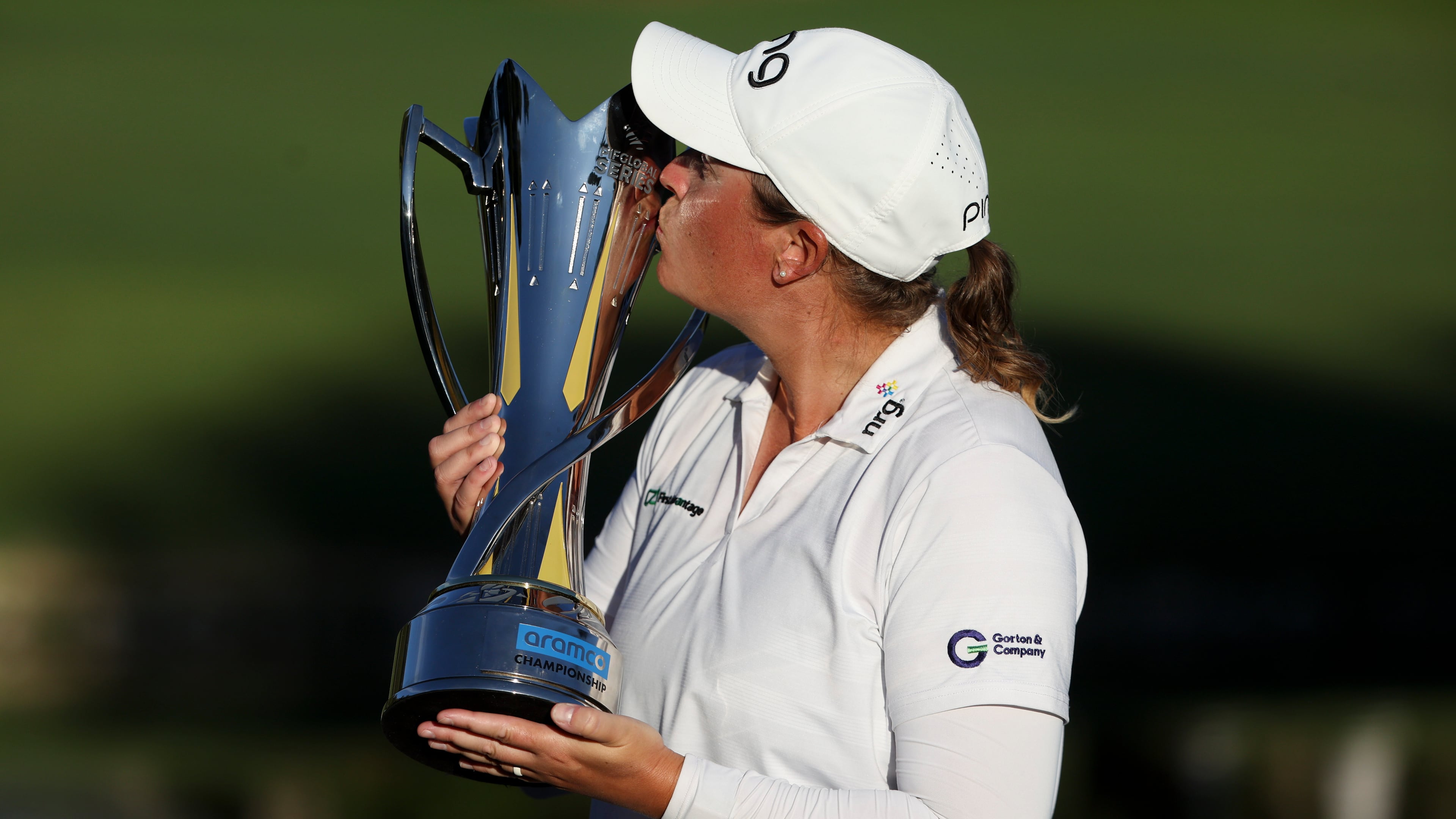 Lauren Coughlin kisses the trophy after winning the Aramco Championship golf tournament Sunday, April 5, 2026, in North Las Vegas, Nev. (AP Photo/Ian Maule)