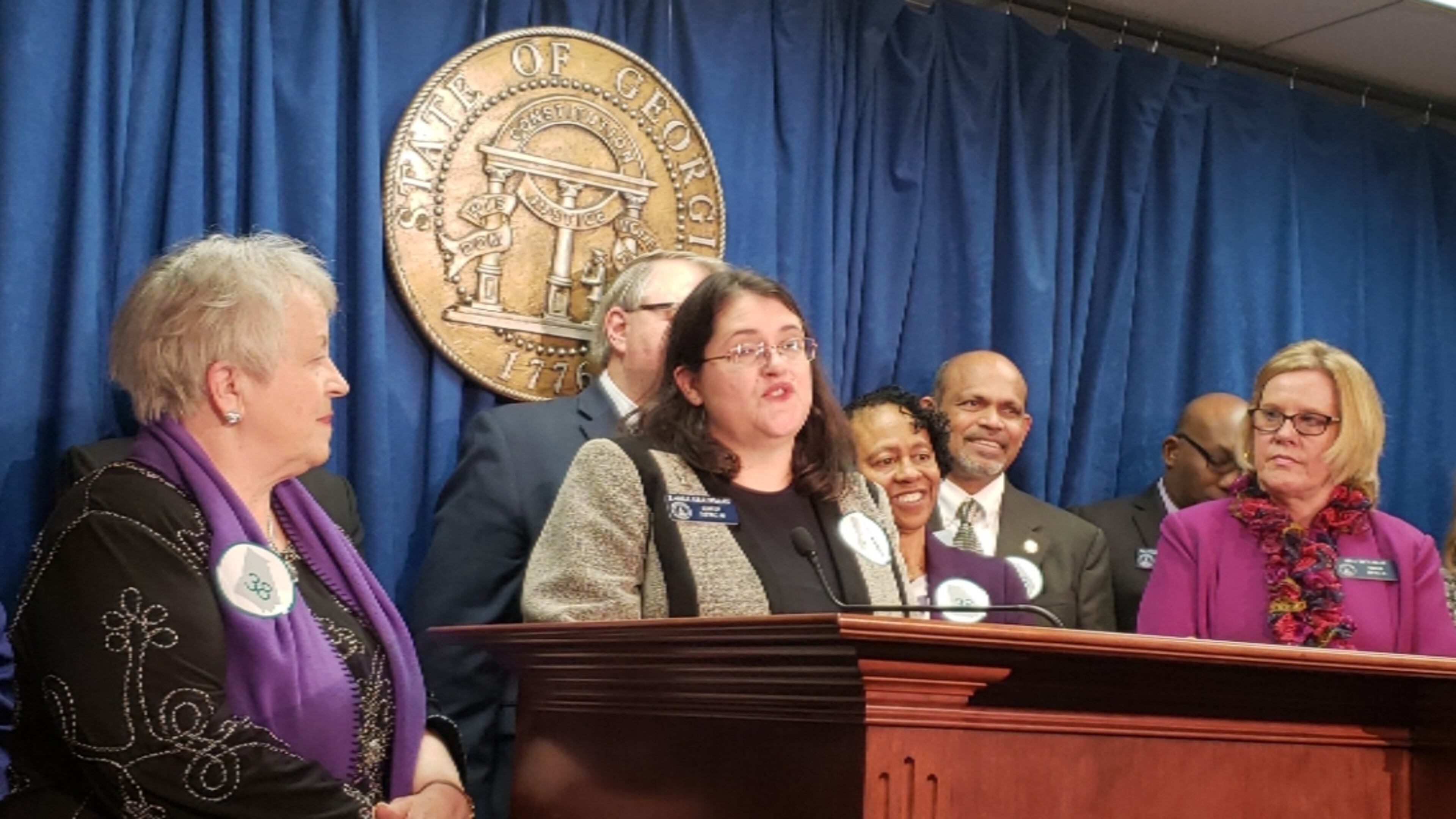 State Sens. Nan Orrock, far left, and Renee Unterman, far right, listen to state Sen. Zahra Karinshak as she speaks in support of ratifying the Equal Rights Amendment. Maya T. Prabhu/maya.prabhu@ajc.com