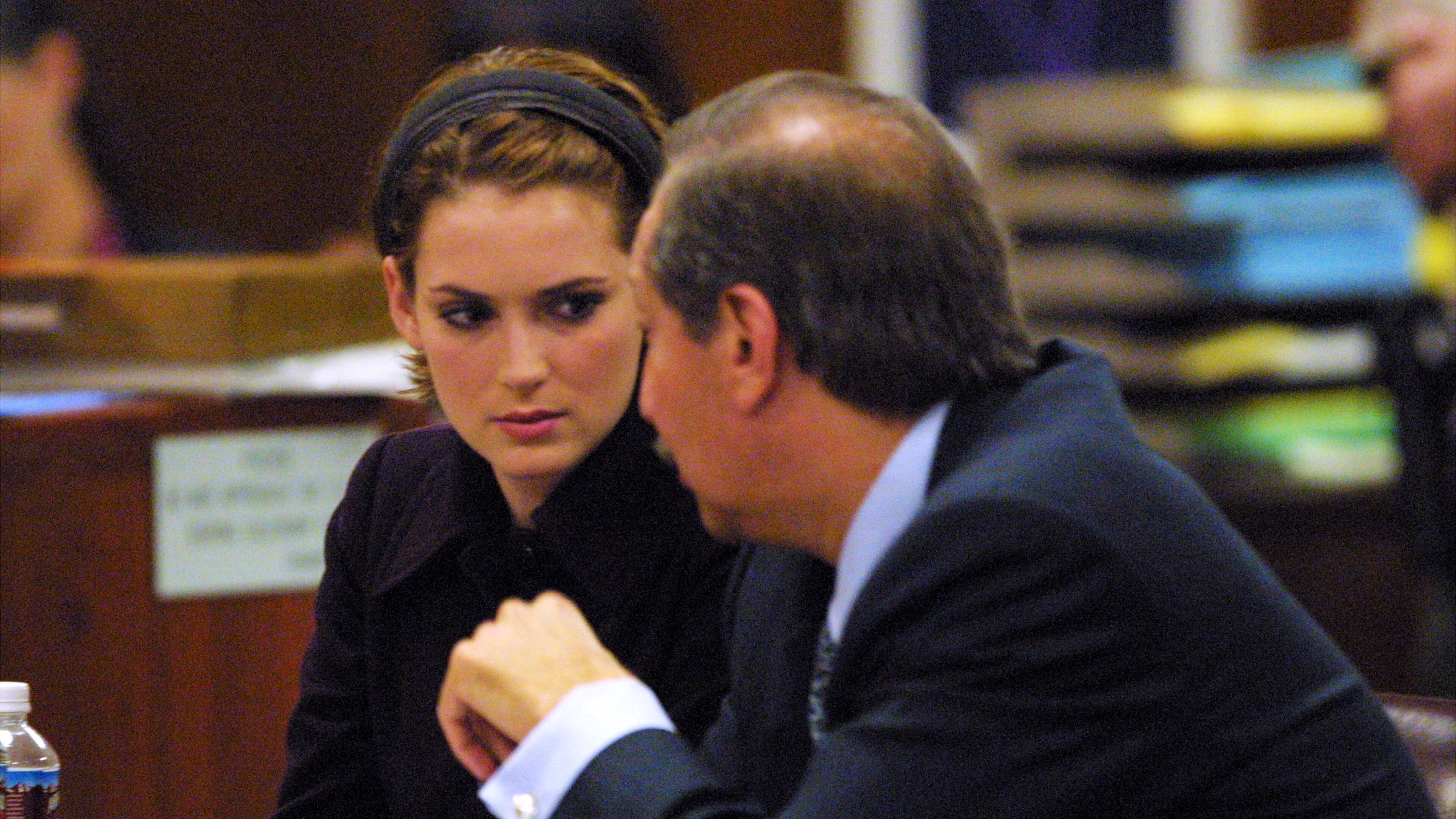 Winona Ryder listens as the verdict is read at the Beverly Hills Municipal Court on the eighth day of her shoplifting trial on November 6, 2002 in Beverly Hills, California. She was found not guilty of burglary charges, guilty of vandalism and felony grand theft charges stemming from her shoplifting arrest December 12, 2001 at a Saks Fifth Avenue store in Beverly Hills.