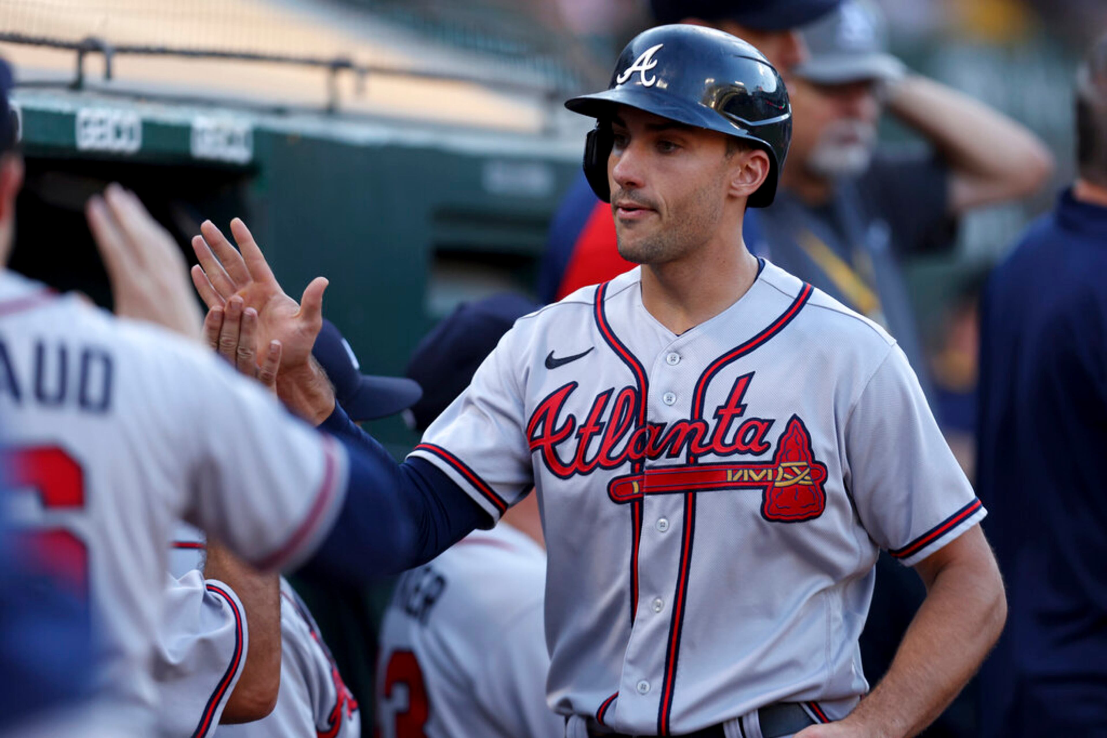 Atlanta Braves' Matt Olson is congratulated by teammates after scoring on a single by Vaughn Grissom against the Oakland Athletics during the first inning of a baseball game in Oakland, Calif., Tuesday, Sept. 6, 2022. (AP Photo/Jed Jacobsohn)
