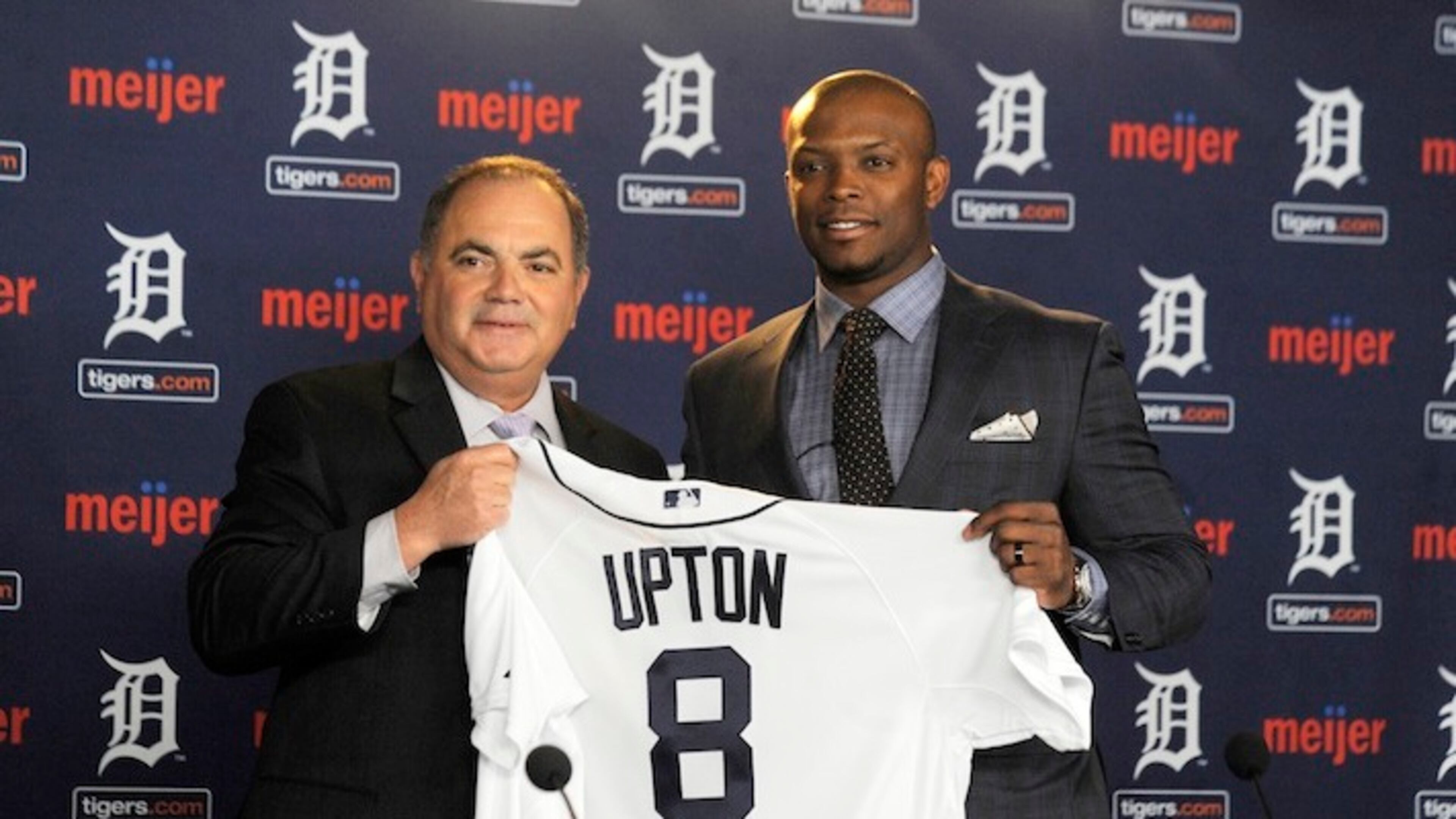 In this Jan. 20, 2016, photo, Detroit Tigers gewneral manager Al Avila, left, poses with new Tigers outfielder Justin Upton after announcing a six-year contract at Comerica Park in Detroit, Mich. (Steve Perez/Detroit News via AP) DETROIT FREE PRESS OUT; HUFFINGTON POST OUT; MANDATORY CREDIT