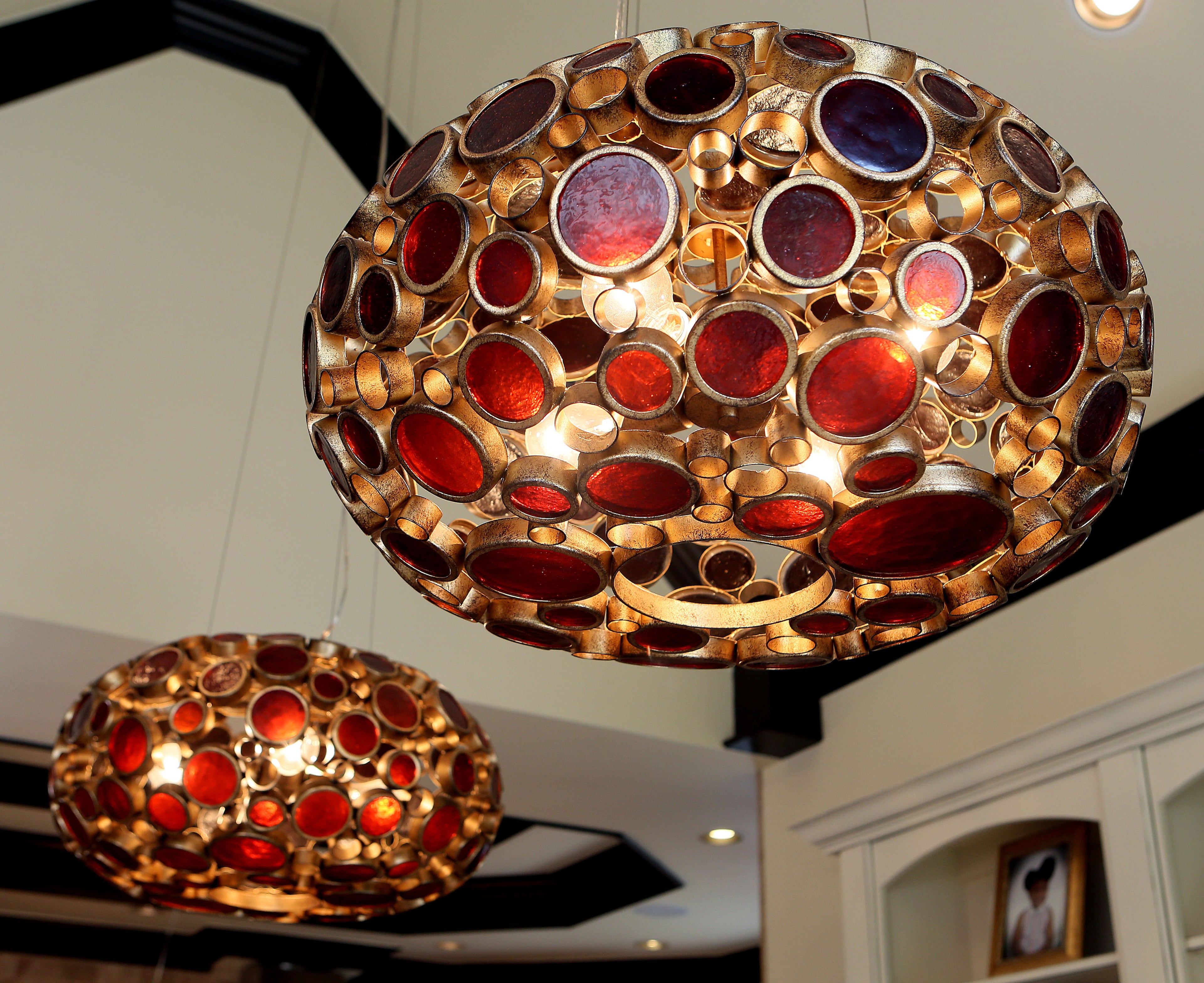 Unique lights hang over the dining area off the kitchen.