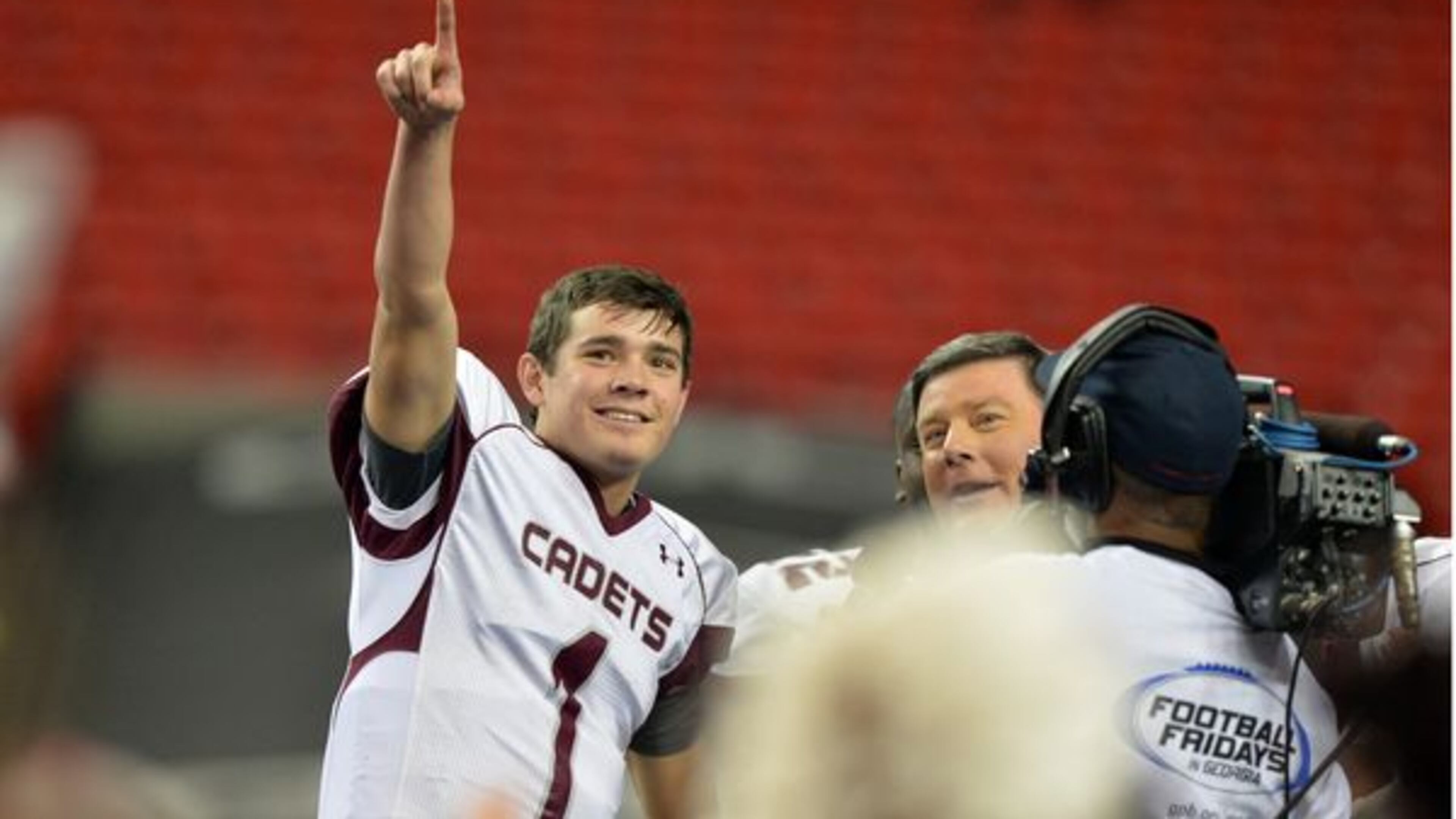 Benedictine quarterback Stevie Powers celebrates the GHSA Class AA Championship win in 2014. Brant Sanderlin/AJC BSANDERLIN@AJC.COM