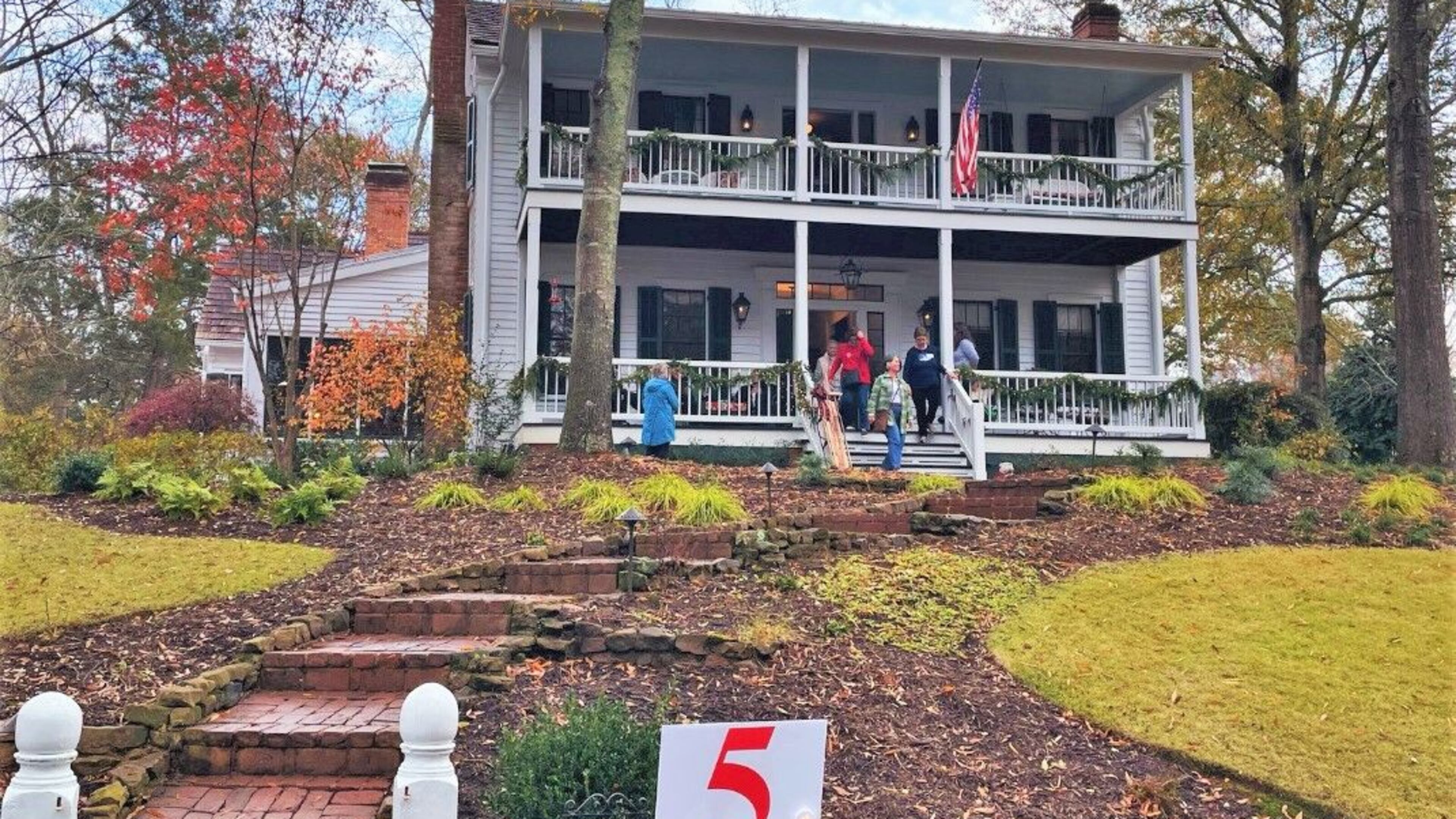 Tourists explore the Caldwell-Cooke-Zant house during the 2022 Holiday Tour of Homes over the weekend.