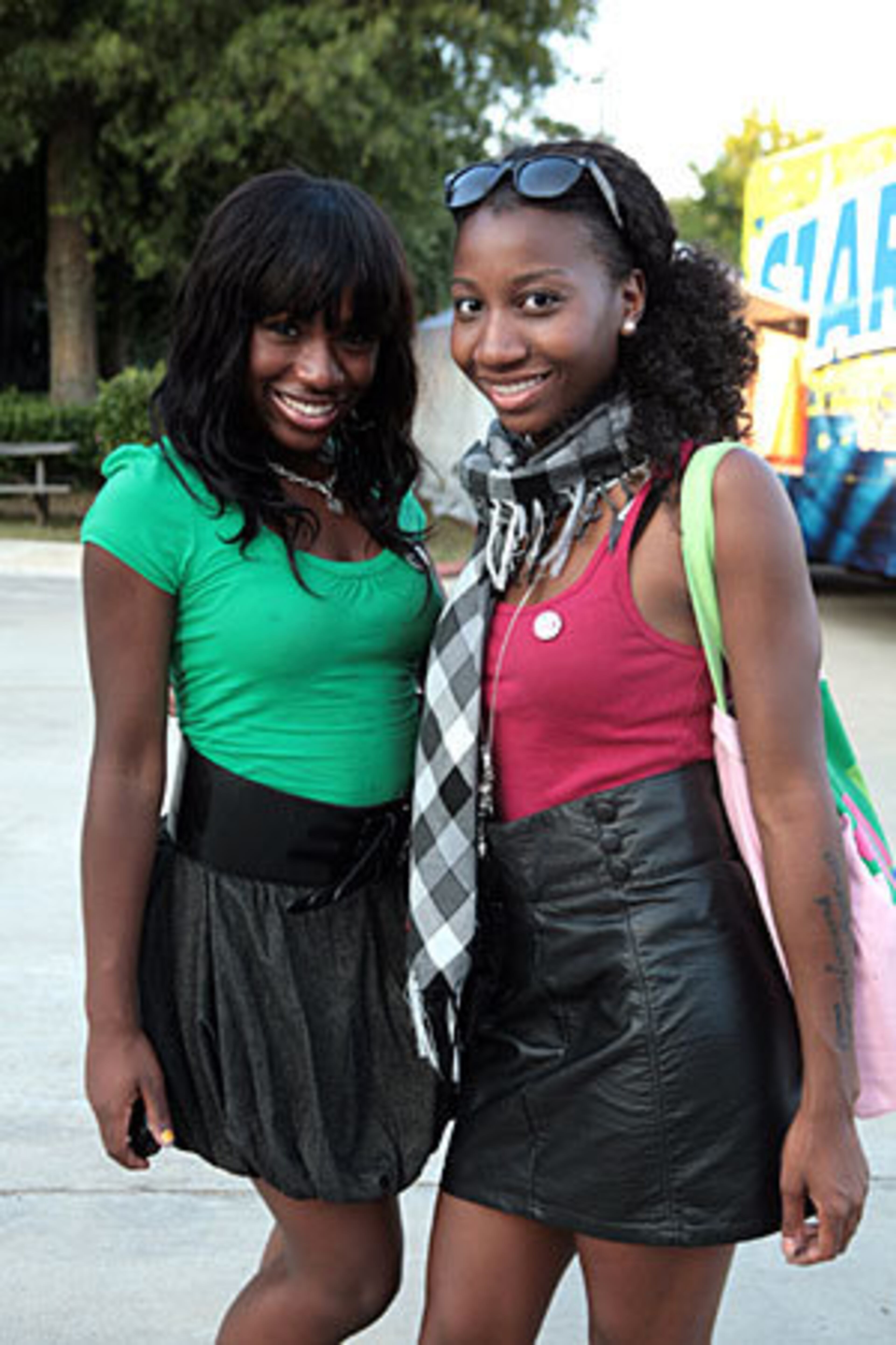 Breanna Carthern, 16, (left) and Carmen Williams, 18, of Atlanta show off their style as they arrive for the Jonas Brothers concert.