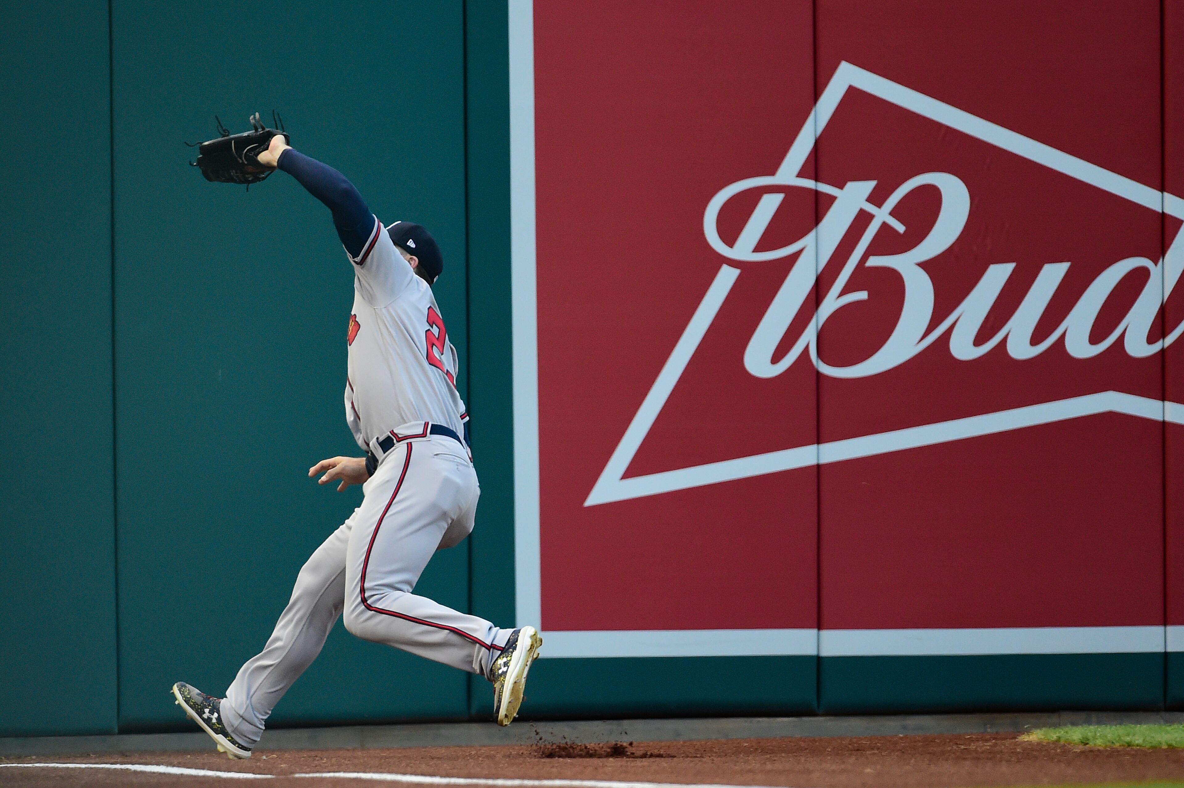 Adam Duvall #23 of the Atlanta Braves catches a fly ball hit by Trea Turner #7 of the Washington Nationals (not pictured) in the first inning at Nationals Park on July 30, 2019 in Washington, DC. (Photo by Patrick McDermott/Getty Images)