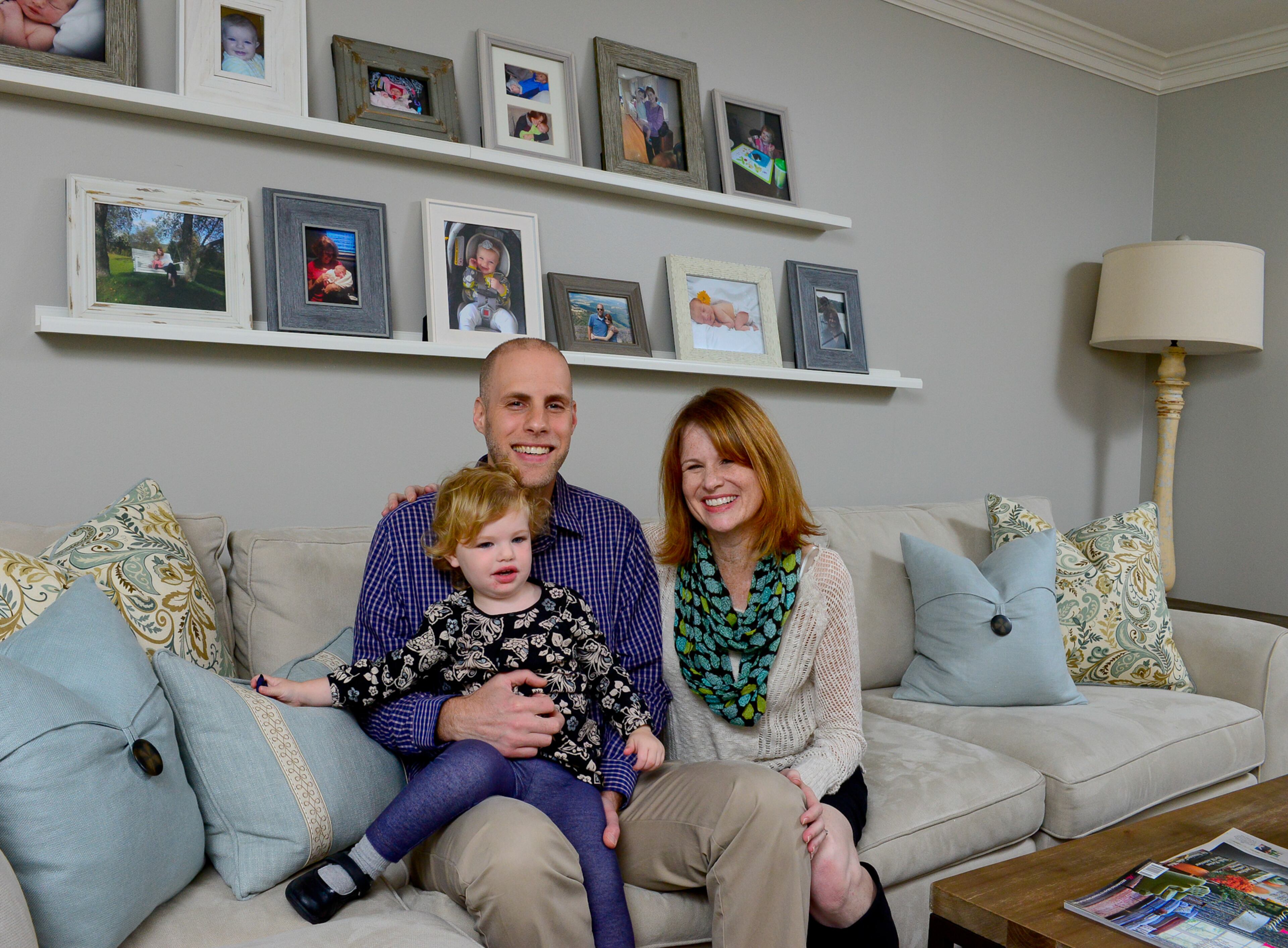 John Morehouse, research engineer at Georgia Tech, and Renee Morehouse, a behavioral scientist at the Centers of Disease Control and Prevention, have settled into their Dunwoody home with 2-year-old daughter Kate Morehouse. They worked with Lauren Harris Interiors on selecting pieces and a palette for spaces including their family room.