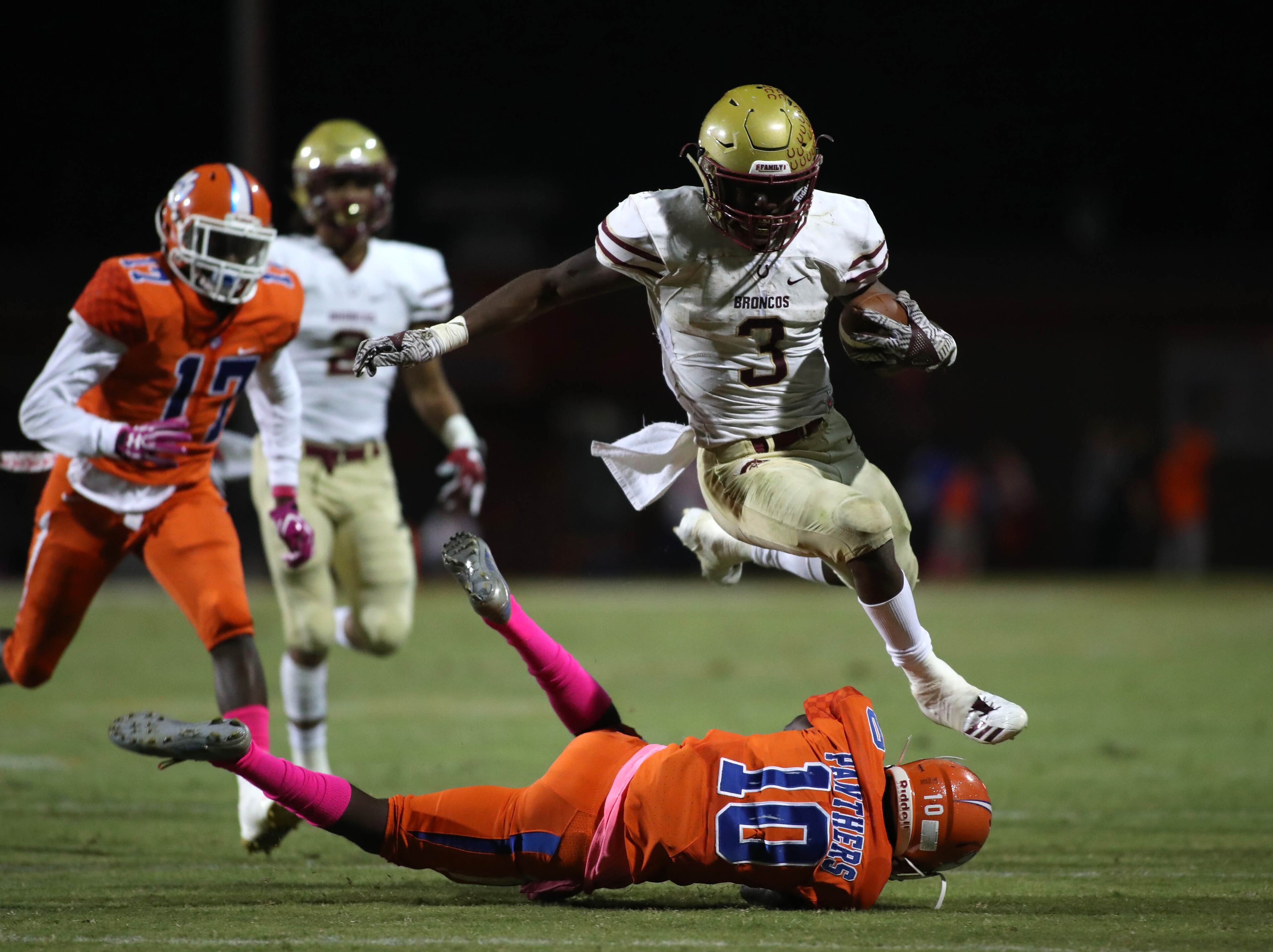 October 20, 2017 - Lilburn, Ga: Brookwood running back Dante Black (3) jumps over Parkview defensive back Matt Chavers (10) in the first half of their game at Parkview High School Friday, October 20, 2017, in Lilburn, Ga.. PHOTO / JASON GETZ
